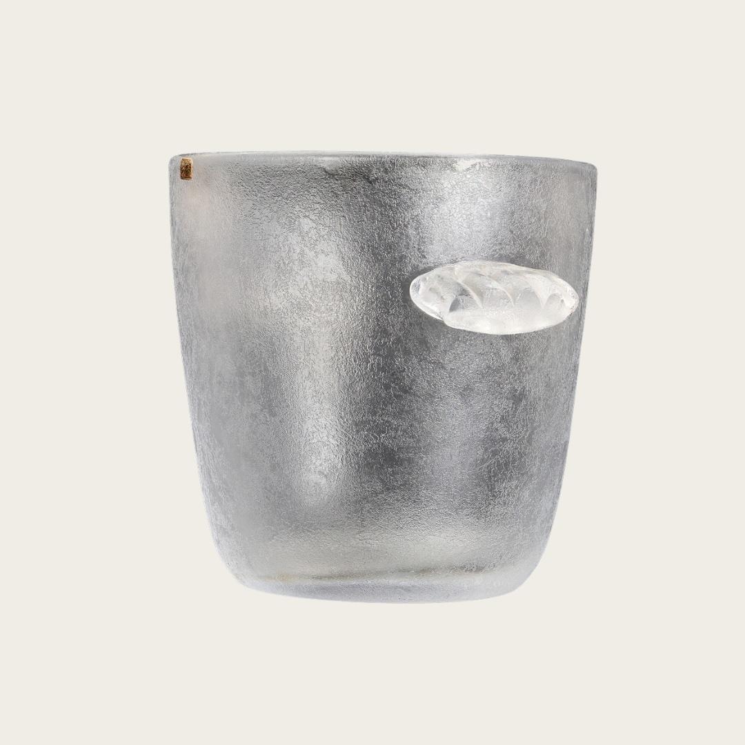 This piece dates back to 1950s Sweden and features ribbed, scalloped hanger details. It includes a Kosta Boda label attached to the side.