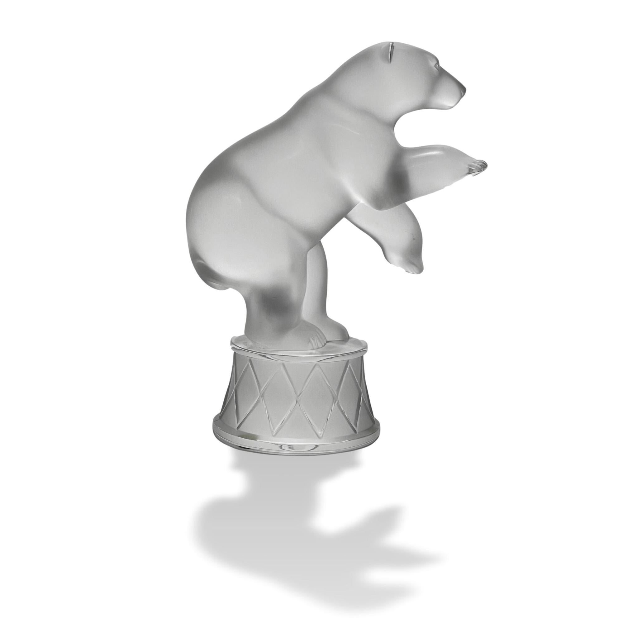 An excellent late 20th century clear and frosted glass study of a bear performing circus tricks with very fine hand chased surface detail, signed Lalique France.