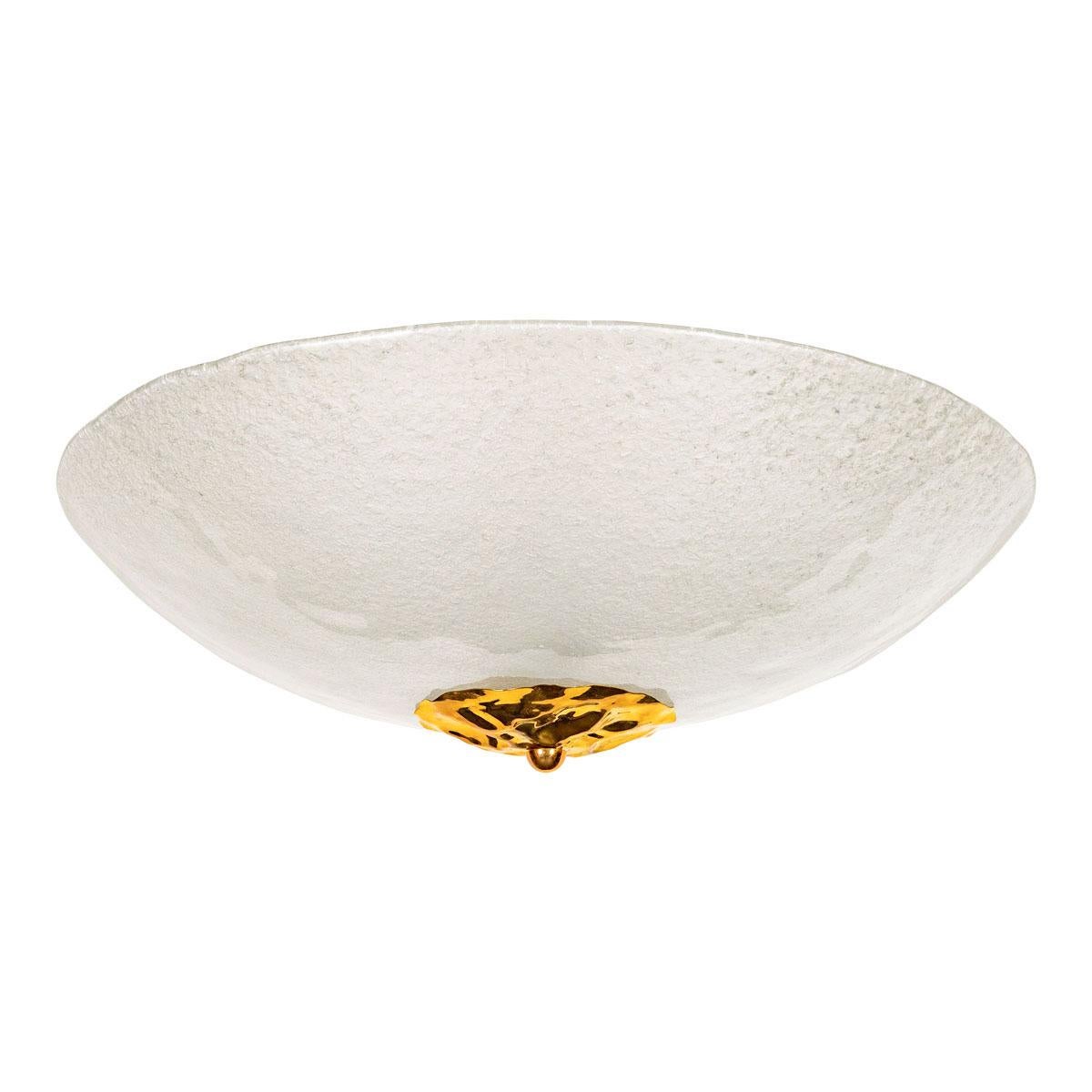 Frosted Murano glass bowl flush mount with hammered brass cap detail.