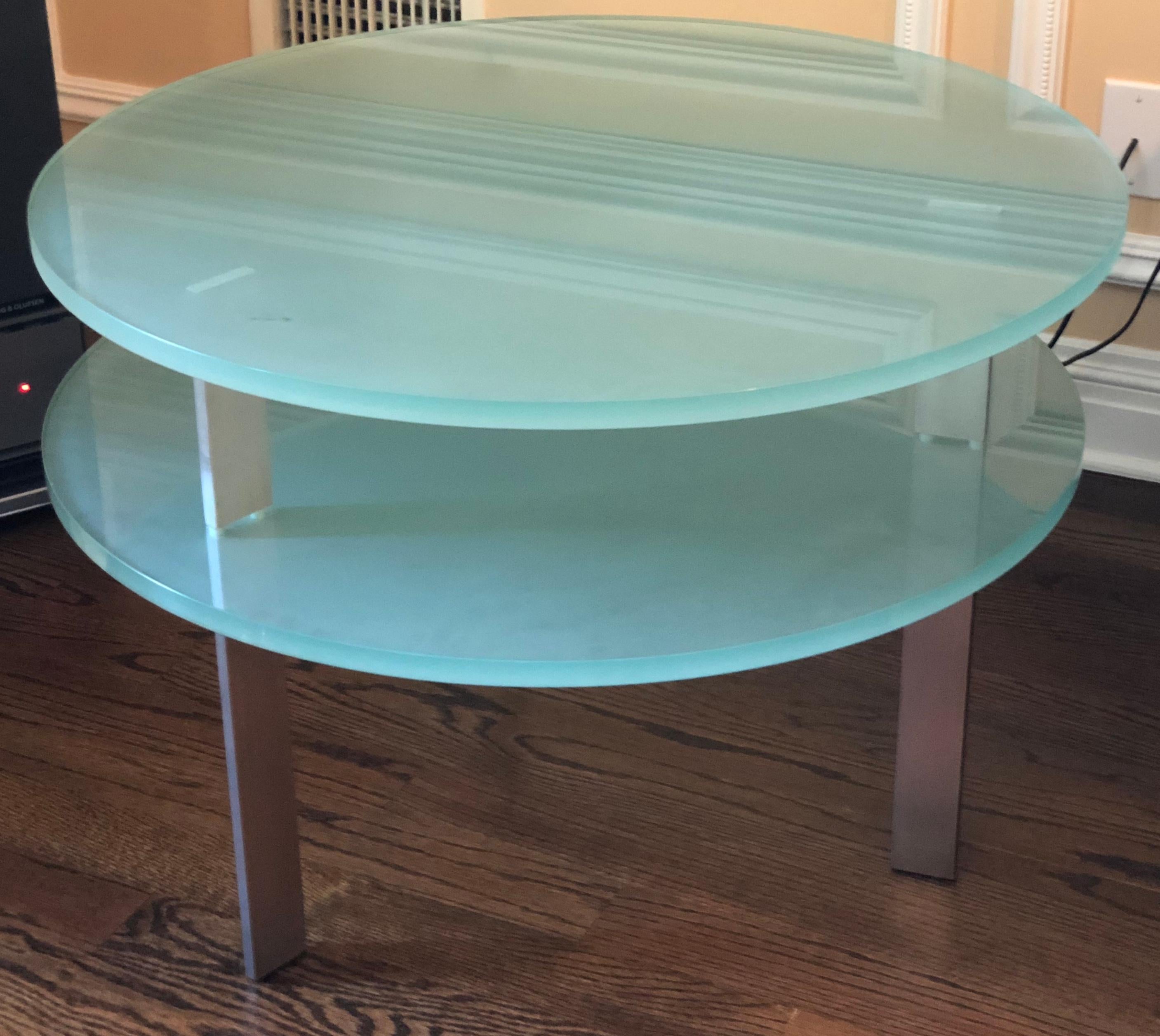 Frosted two level glass round end table by Pace Collection with matte aluminum legs. The lower shelf sits at 15.5