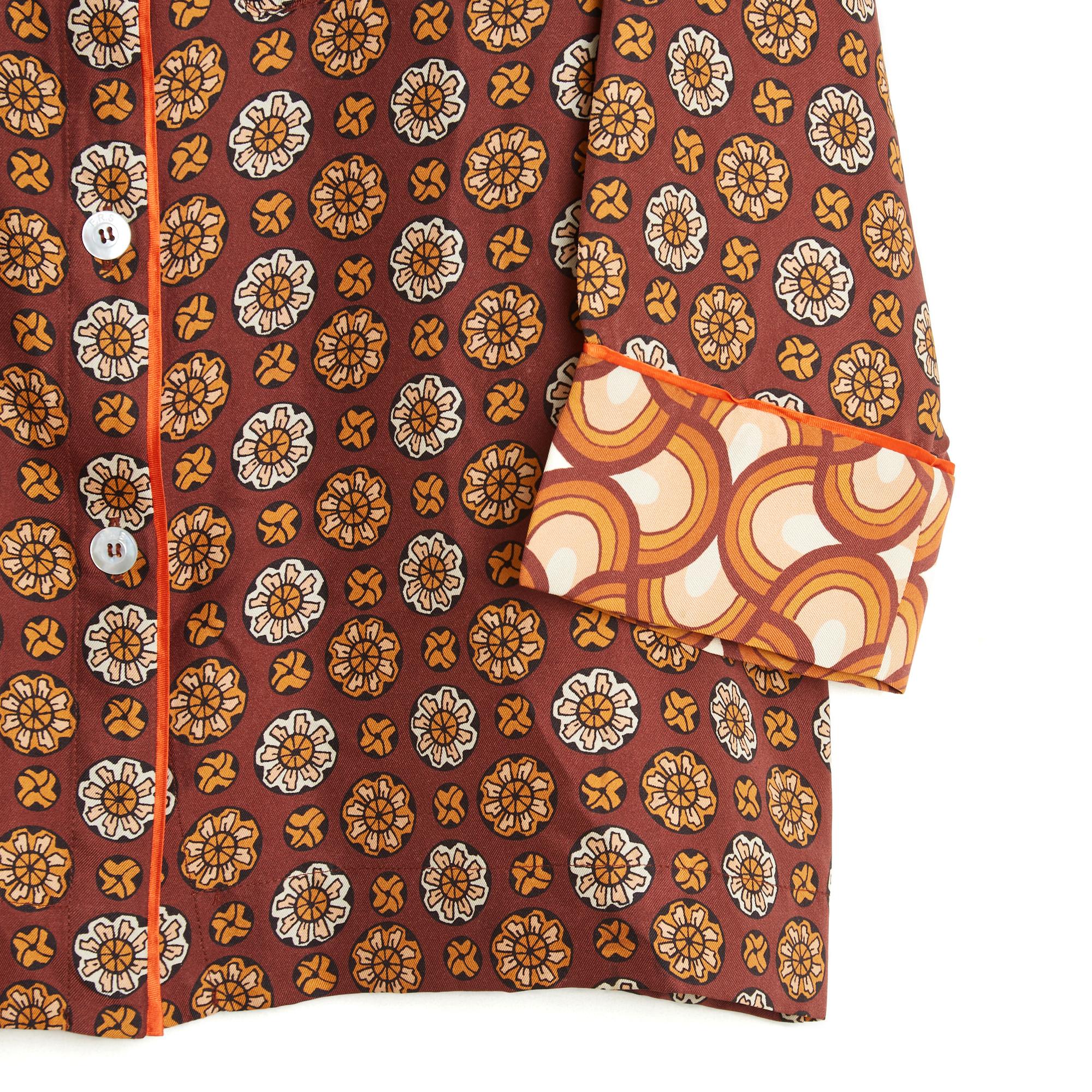 F.R.S For Restless Sleepers top or jacket inspired by pyjamas in multicoloured silk twill with a geometric pattern in the 1970s style, front fastening with 6 mother-of-pearl buttons with the F.R.S. logo, a patch pocket on the chest, 3/4 sleeves with