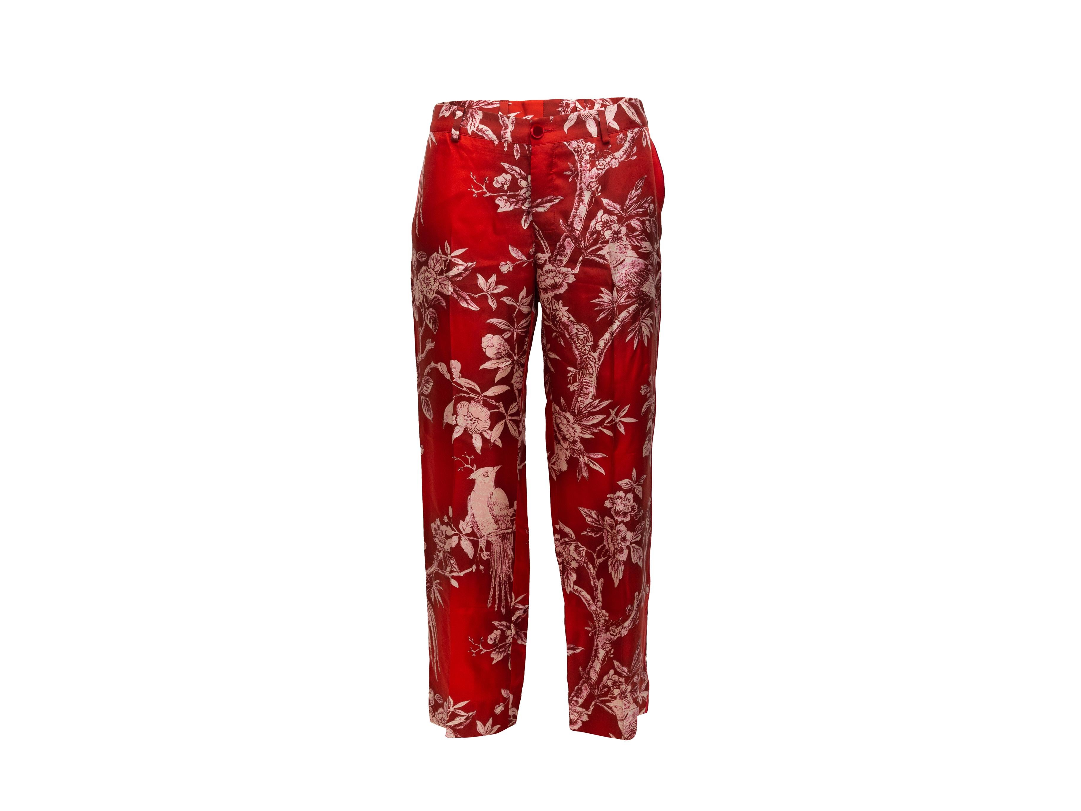Product details: Red and white silk bird print pants by F.R.S. For Restless Sleepers. Dual back pockets. Button closure at front. 32