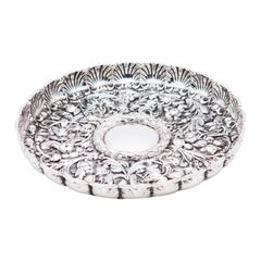 Fruit bowl centerpiece in silver profusely embossed with flowers