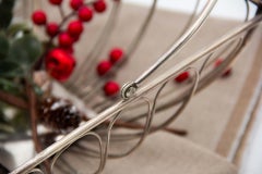 Fruit bowl in silver wire with movable articulated handle