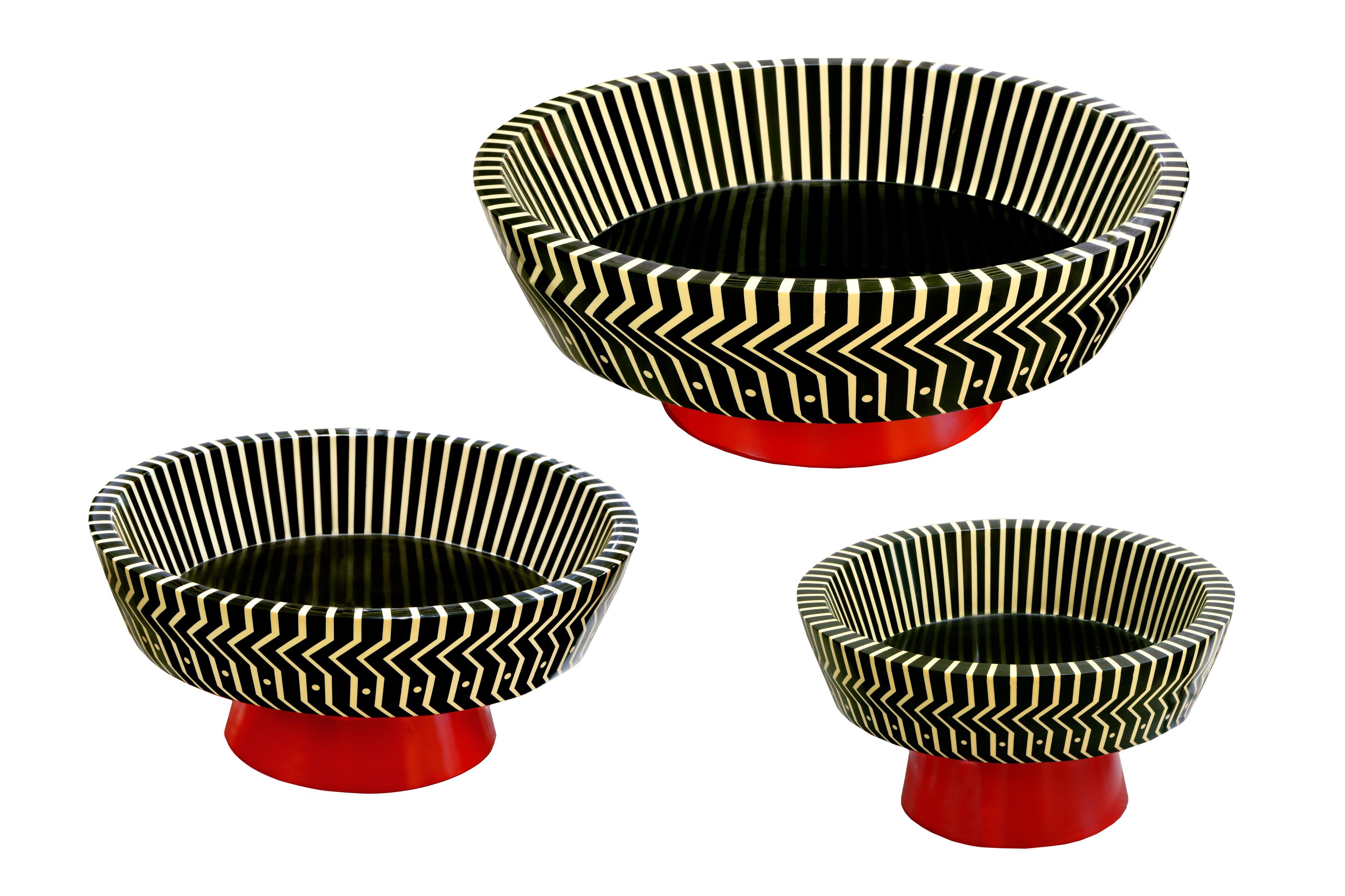 Fruit bowl is a gorgeous accessory that immediately demands visual attention. It has a striking vanilla and black pattern offset by a scarlet base. Available in three sizes.

India's handicrafts are as multifarious as its cultures, and as rich as