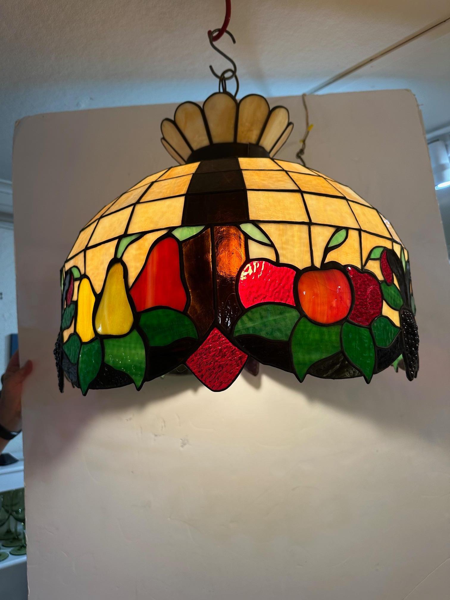 Classic colorful leaded glass chandelier having fruit decoration.

21” Diameter 18” H
16” Chain
No canopy