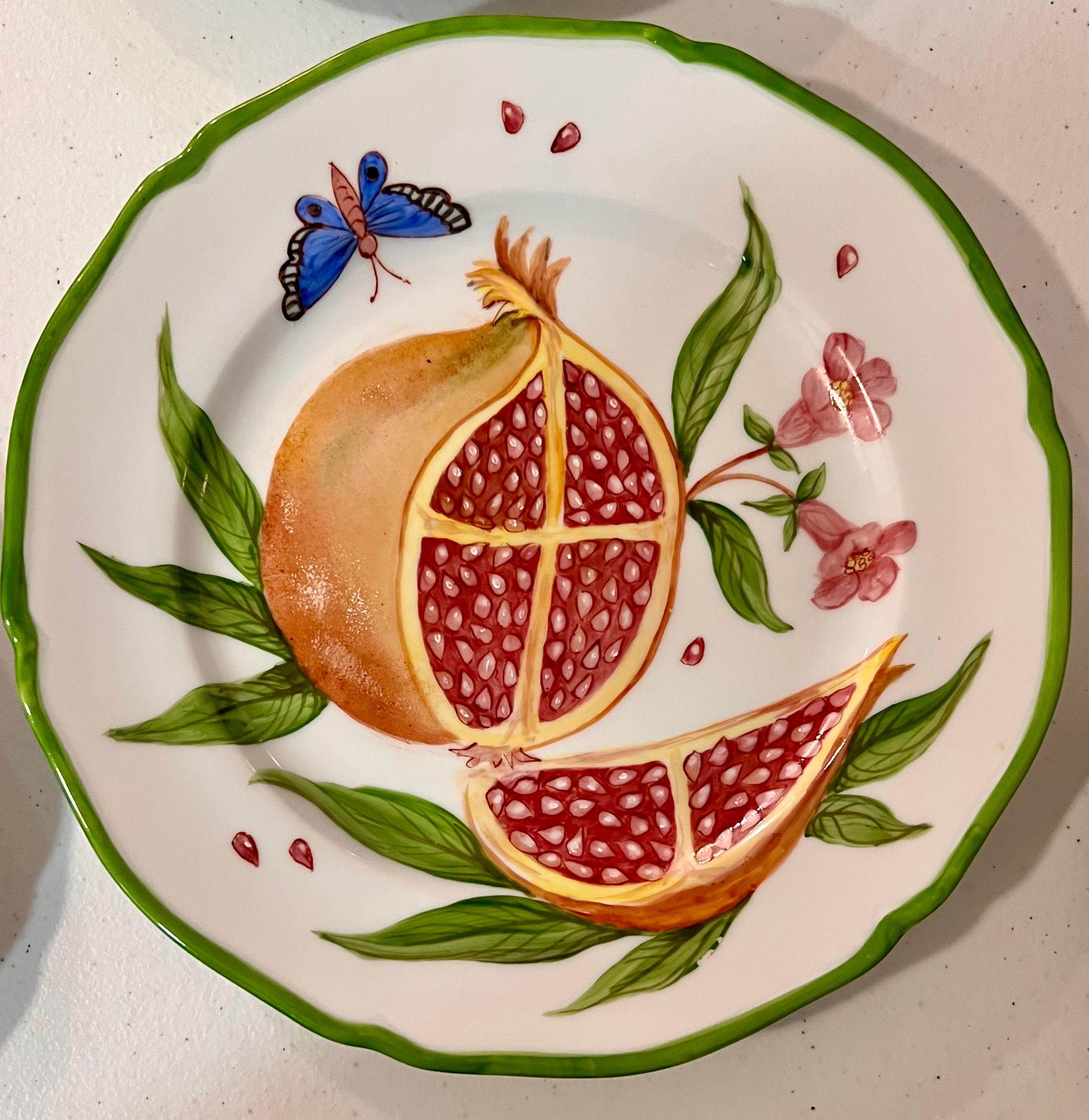 Giovanna Amoruso Manzari hand painted partial table service for Limoges, decorated with fruit, flowers, and butterflies.
Measure 8.66 inches / 22 cm 
* Request info for flatware price for individual plate but if set pirce arranges. 

PRADERA is a