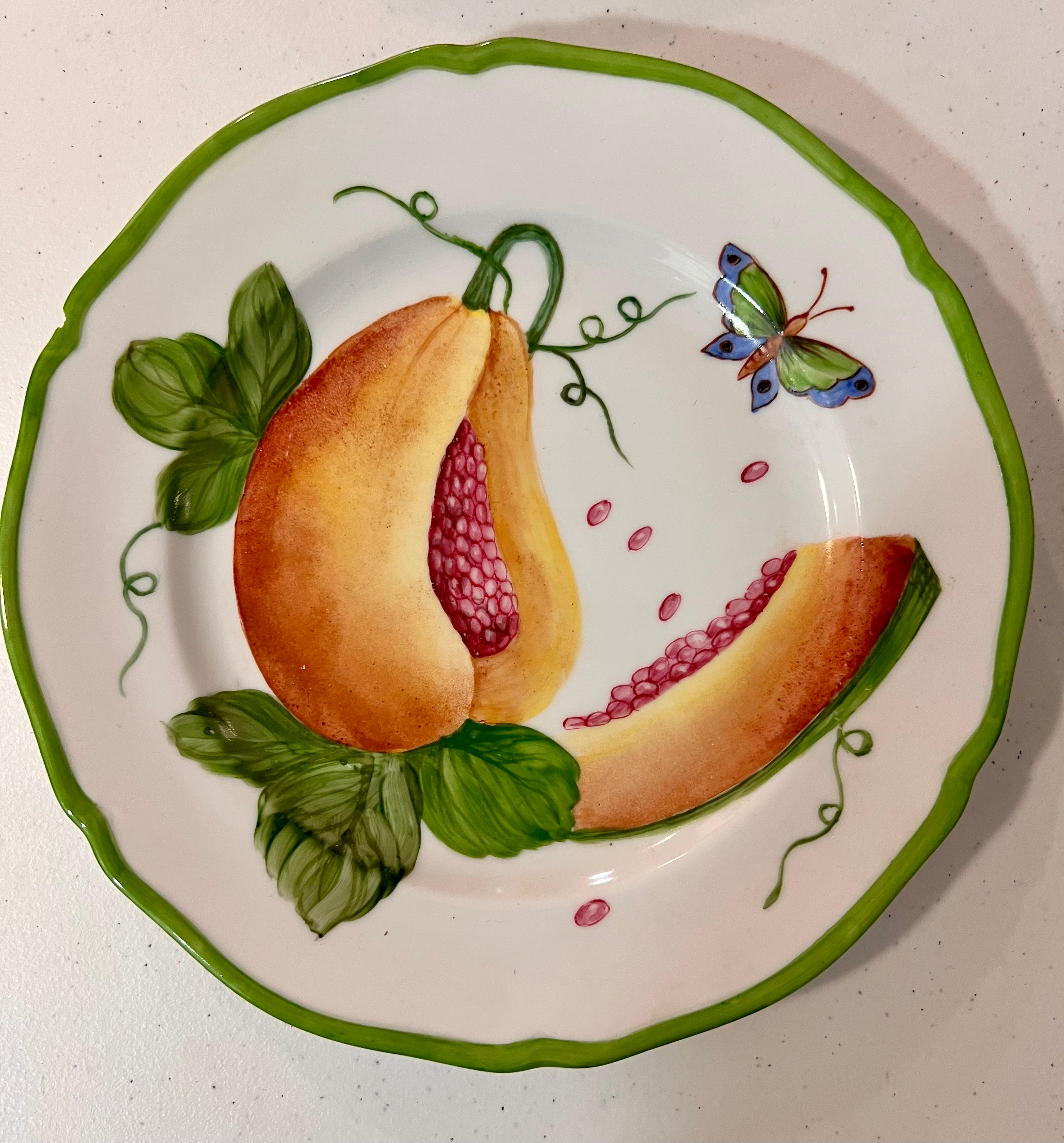 Giovanna Amoruso Manzari hand painted partial table service for Limoges, decorated with fruit, flowers, and butterflies.
Measure 8.66 inches / 22 cm 
* Request info for flatware price for individual plate but if set pirce arranges. 

PRADERA is
