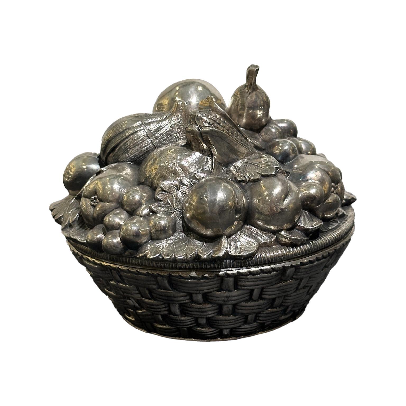 Fruit basket ice bucket created by the Italian designer Mauro Manetti, circa 1970. Productions realized after the 1960s had the inside made of metal and the outside is still made of silver-plated cast aluminum.

Mark under the base 