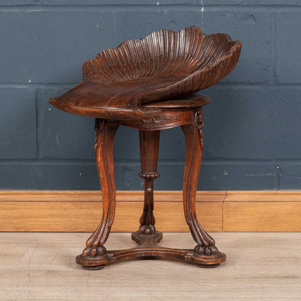 A beautiful carved antique fruitwood grotto stool, the bench standing on cabriole legs joined with a bottom stretcher, and bun feet reminiscent of animal paws, made in Venice around the turn of the 19th century.

Condition
In Great Condition -