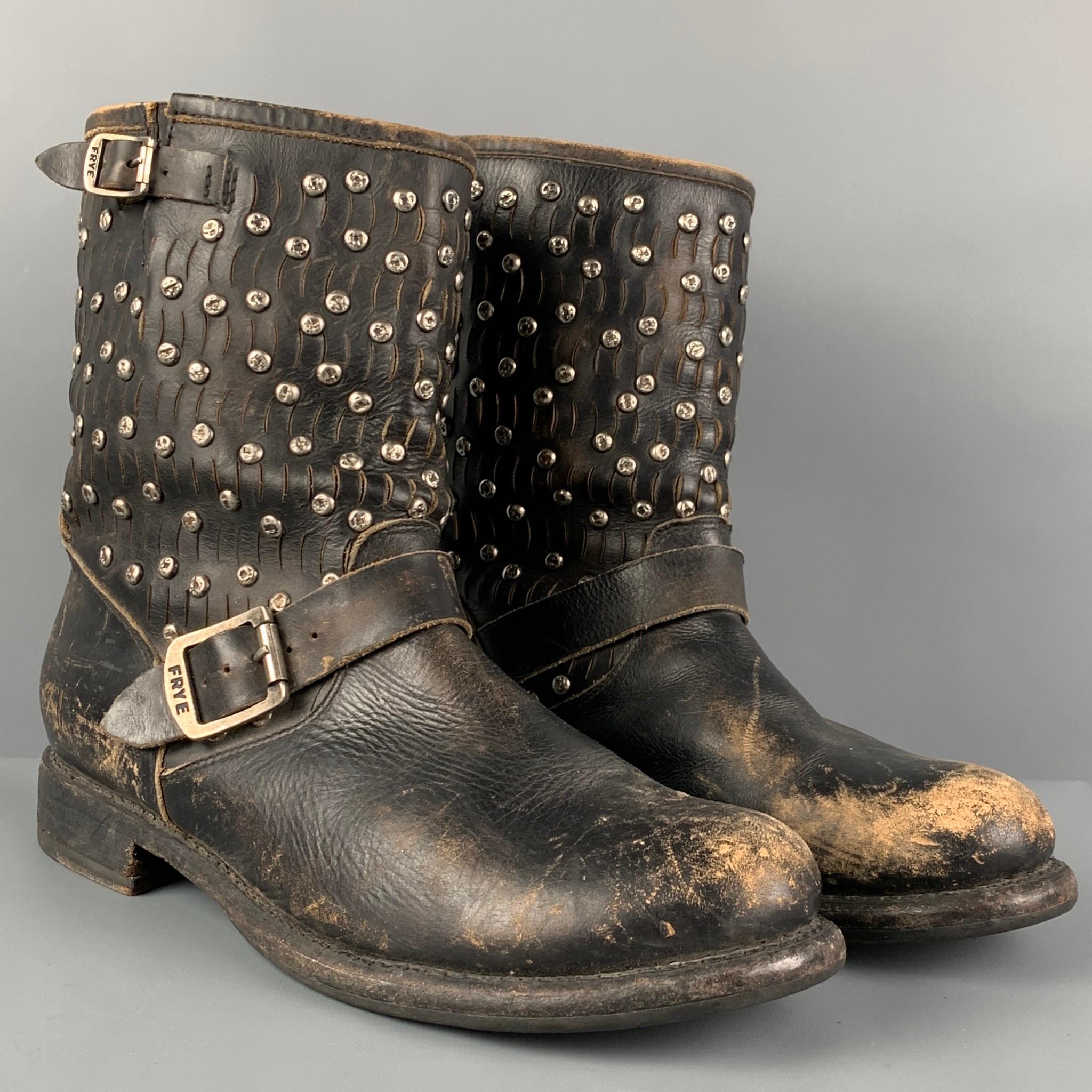 FRYE ankle boots comes in a black distressed leather featuring silver tone studded details, round toe, and a buckle closure. 

Good Pre-Owned Condition.
Marked: 11 B

Measurements:

Length: 11.5 in.
Width: 4 in.
Height: 8.25 in. 