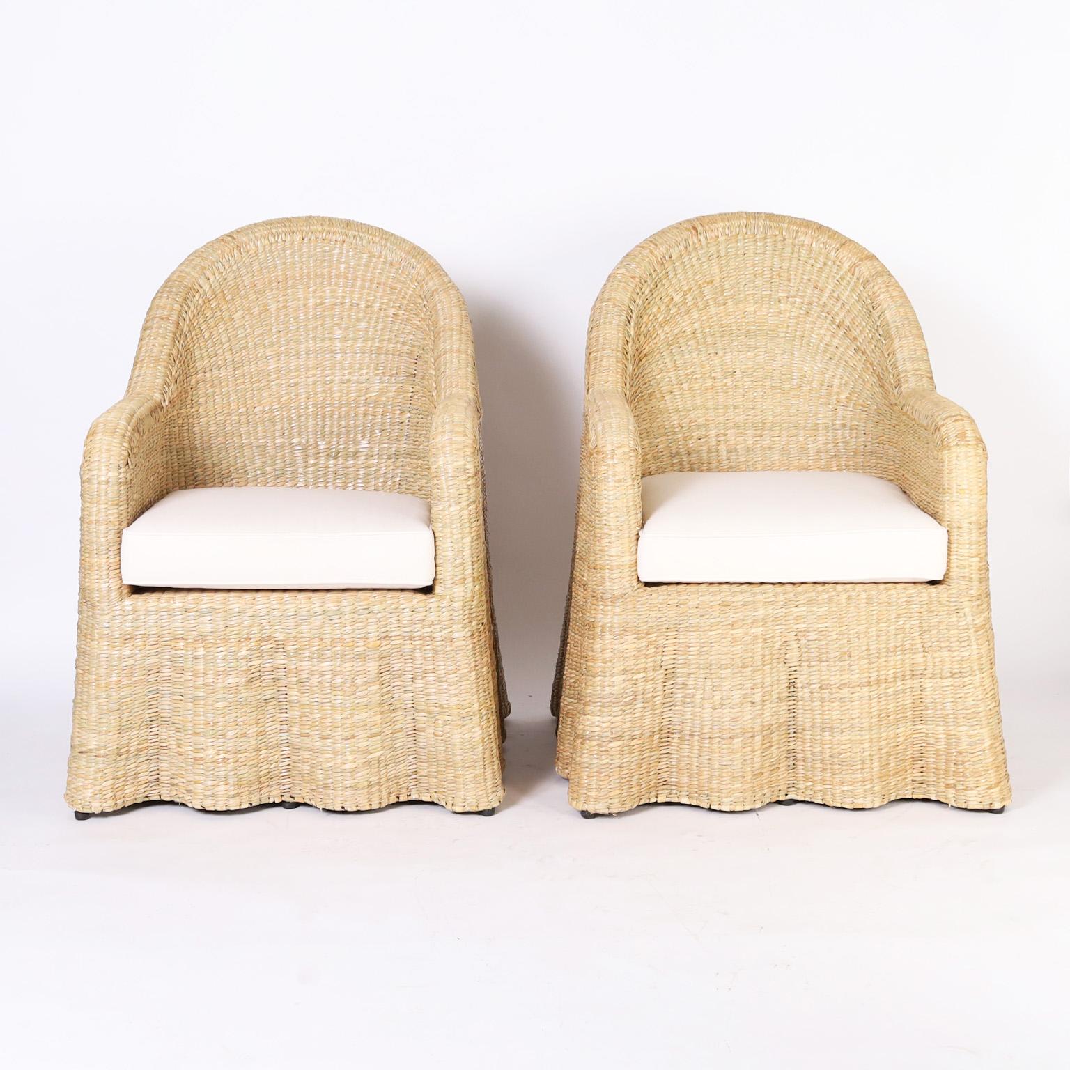 Chic midcentury inspired pair of ghost drapery armchairs handcrafted with a durable metal frame wrapped in reed with a tight elegant form, from the 2023 FS Flores Collection designed and manufactured exclusively by F.S. Henemader Antiques.