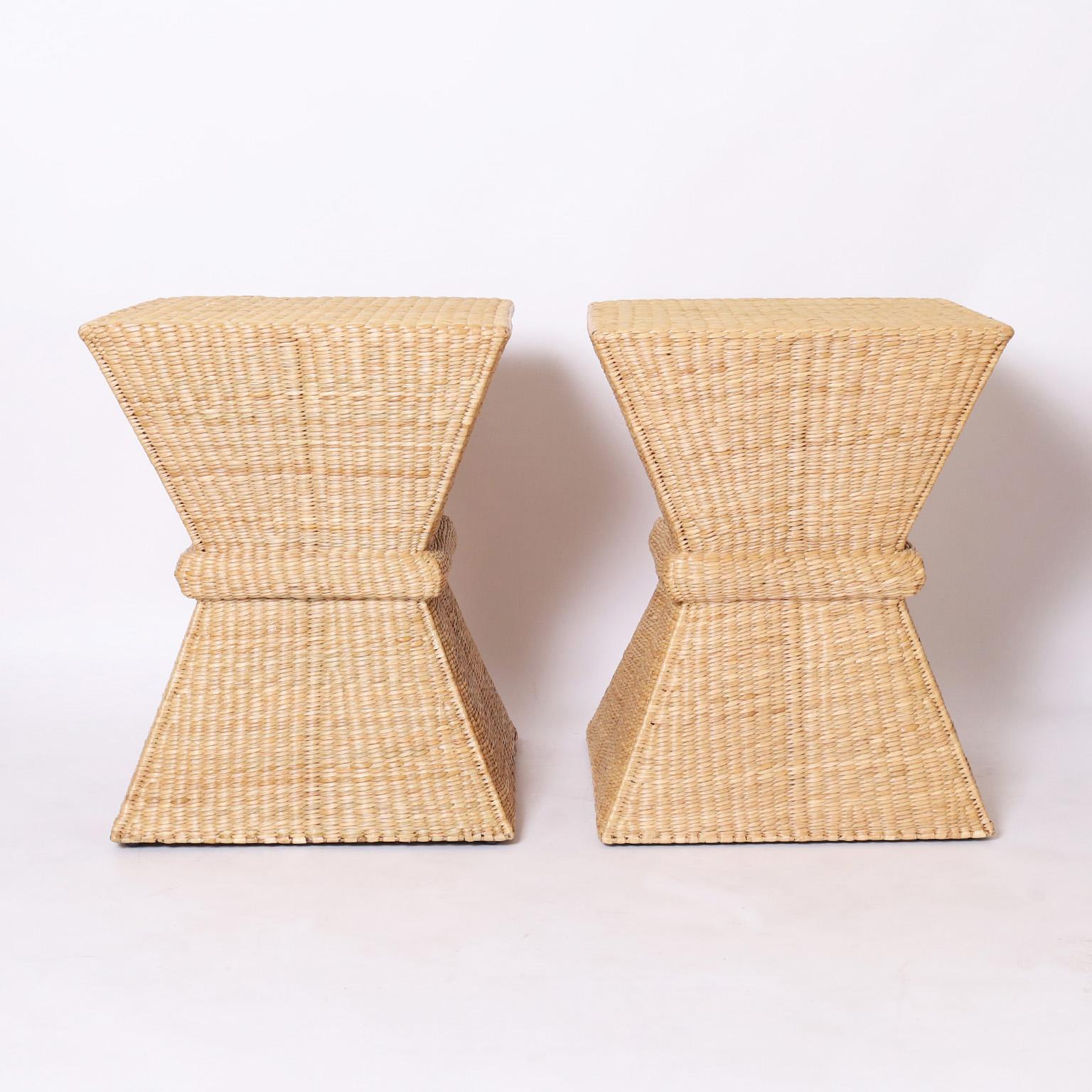 Pair of midcentury hourglass inspired stylized sheaf of wheat stands or tables handcrafted with a sturdy metal frame wrapped in reed from the FS Flores Collection designed and manufactured exclusively by F.S. Henemader Antiques.
