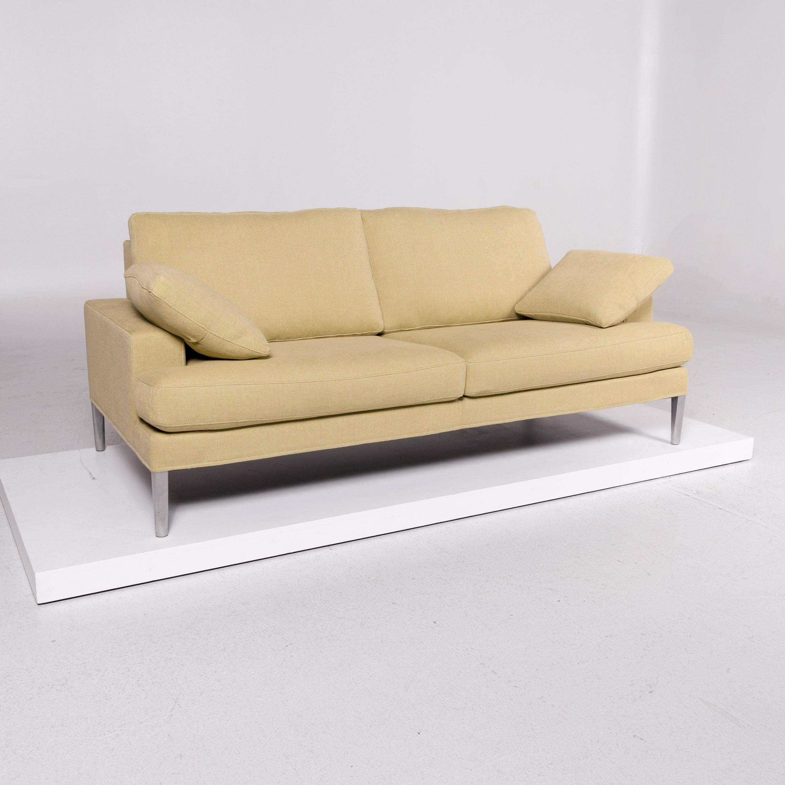 We bring to you a FSM Clarus fabric sofa yellow lemon yellow two-seat couch.
 

 Product measurements in centimeters:
 

Depth 96
Width 190
Height 86
Seat-height 45
Rest-height 53
Seat-depth 52
Seat-width 126
Back-height 30.
 