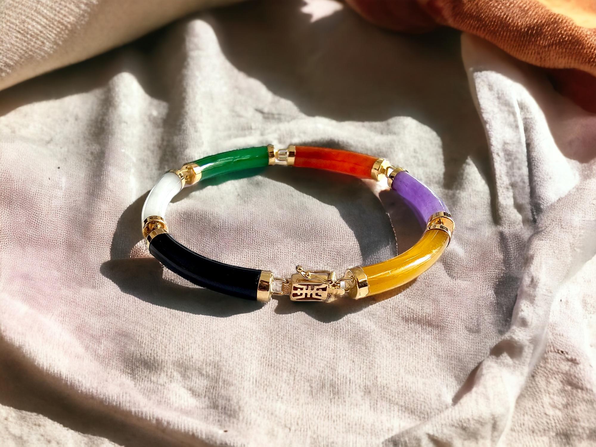 Fu Fuku Fortune Eclectic Green Jade, Red Jade, Purple Jade, Yellow Jade, Black Onyx, White MOP Tube Bracelet (with 14K Yellow Gold)

With our classical 'Fu Fuku Fortune' design, we made a eclectic bracelet perfect to add a splash of abstract colors