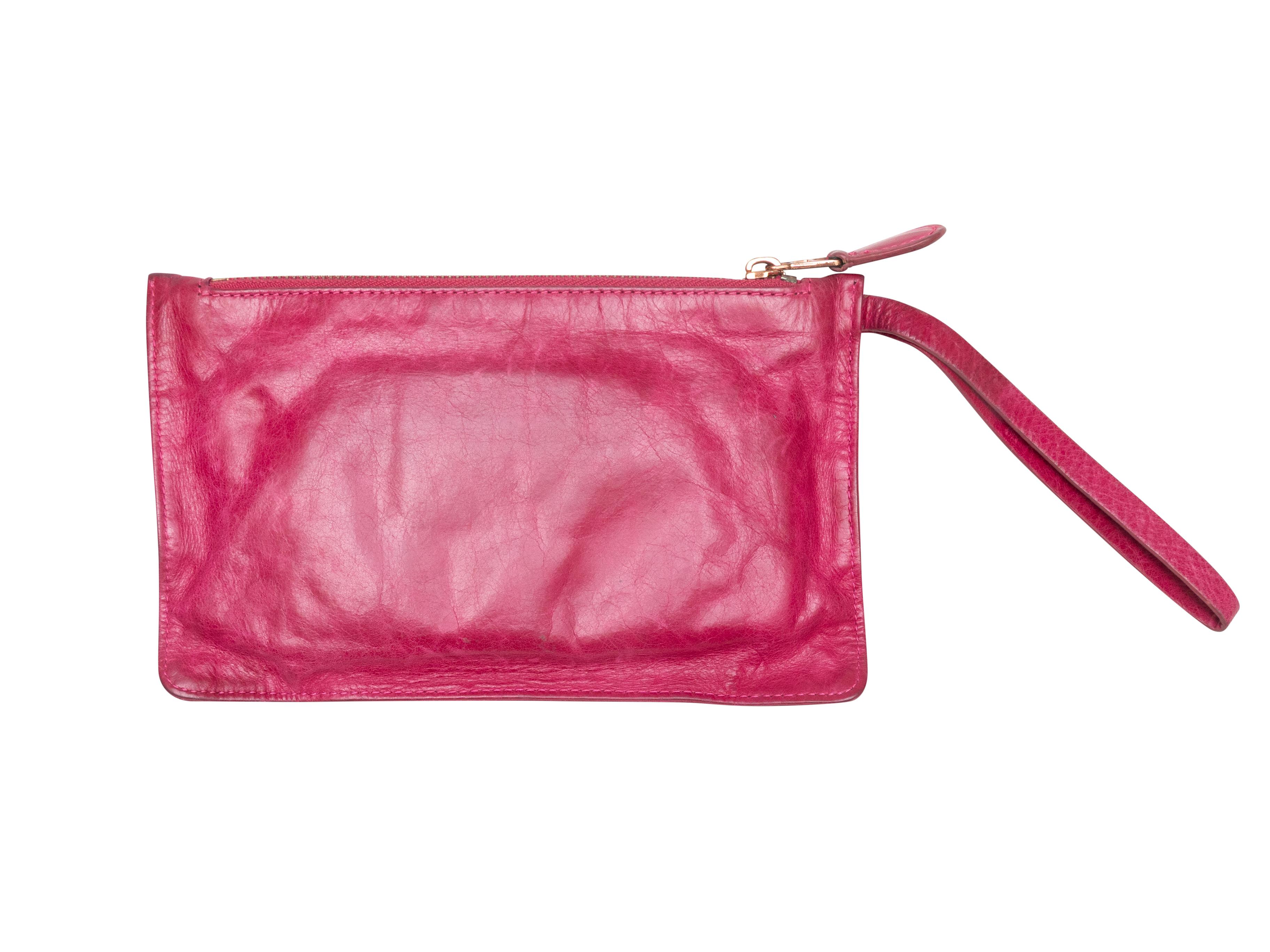 Fuchsia Le City zip wallet by Balenciaga. Gold-tone hardware. Front zip pocket. Wristlet strap. Top zip closure. 5.5
