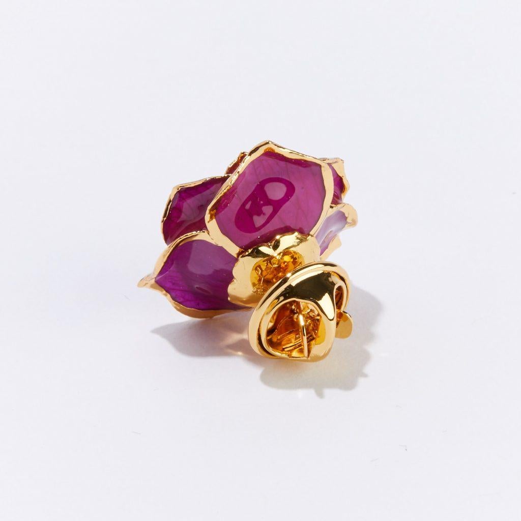 Make a colorful statement, or bold declaration of love, with our Fuchsia Eternal Lapel Pin. Sultry hues of red and purple play with gold-trimmed real rose petals in this beautifully crafted piece. Both vibrant and enchanting, our one-of-a-kind