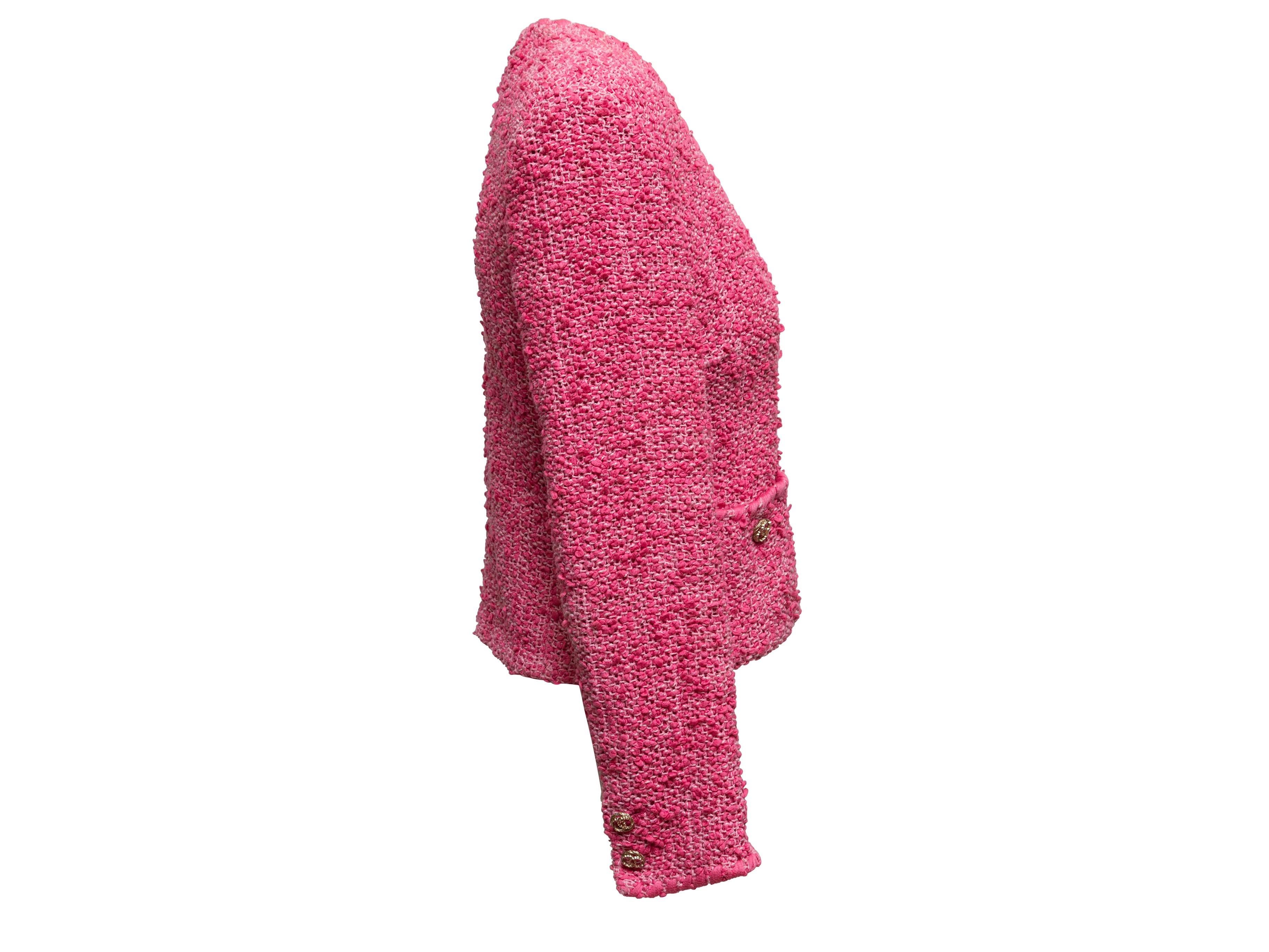 Fuchsia collarless slub tweed jacket by Chanel. From the Cruise 2021 Collection. V-neck. Dual front pockets. Front closures. 38