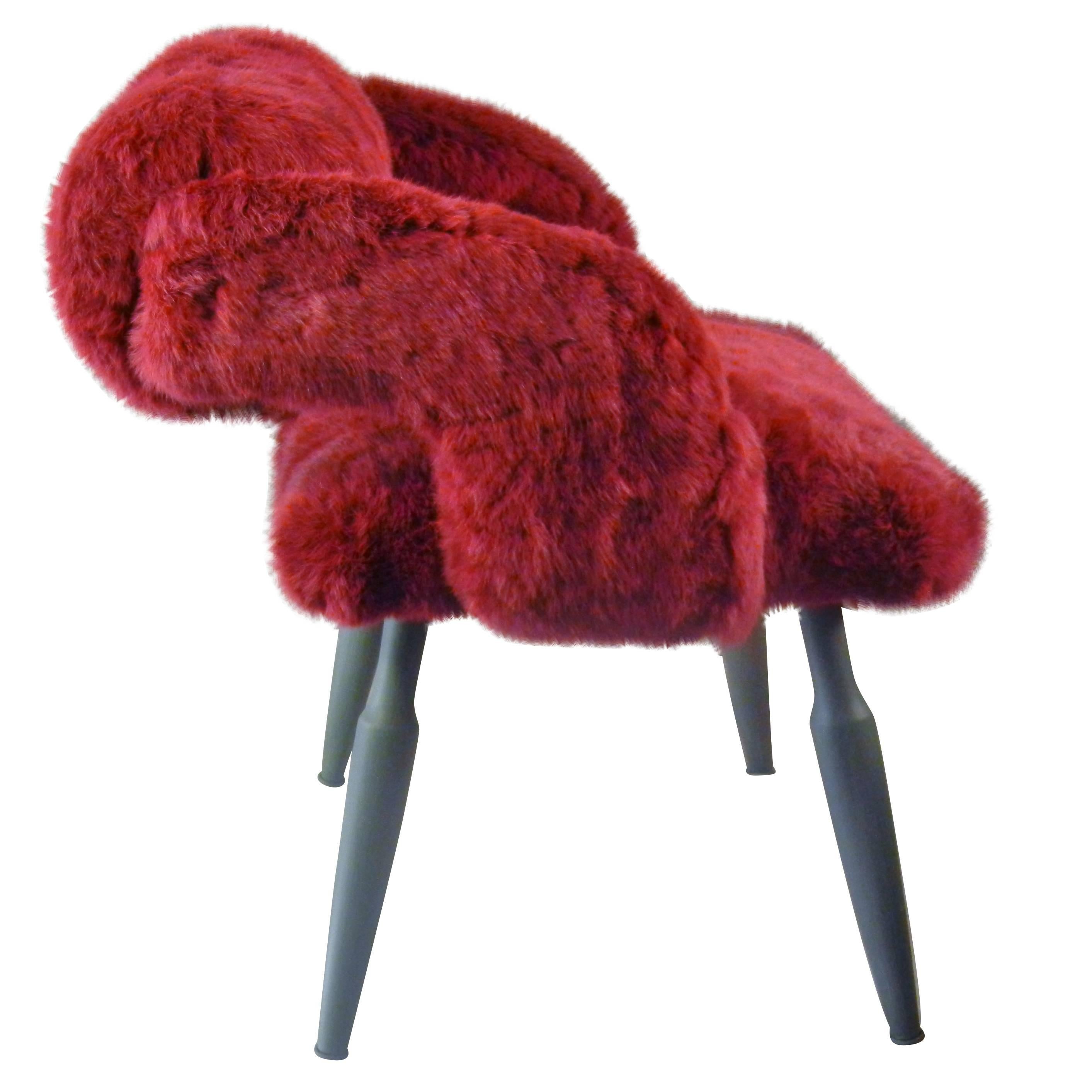 This signed, artist-designed chair is by Rodrigo Velasquez Godoy, a Montreal--based contemporary sculptor, painter and designer. Here he used a Mid-Century vanity chair to create a one-of-a-kind boudoir chair upholstered in fuchsia-dyed rabbit fur