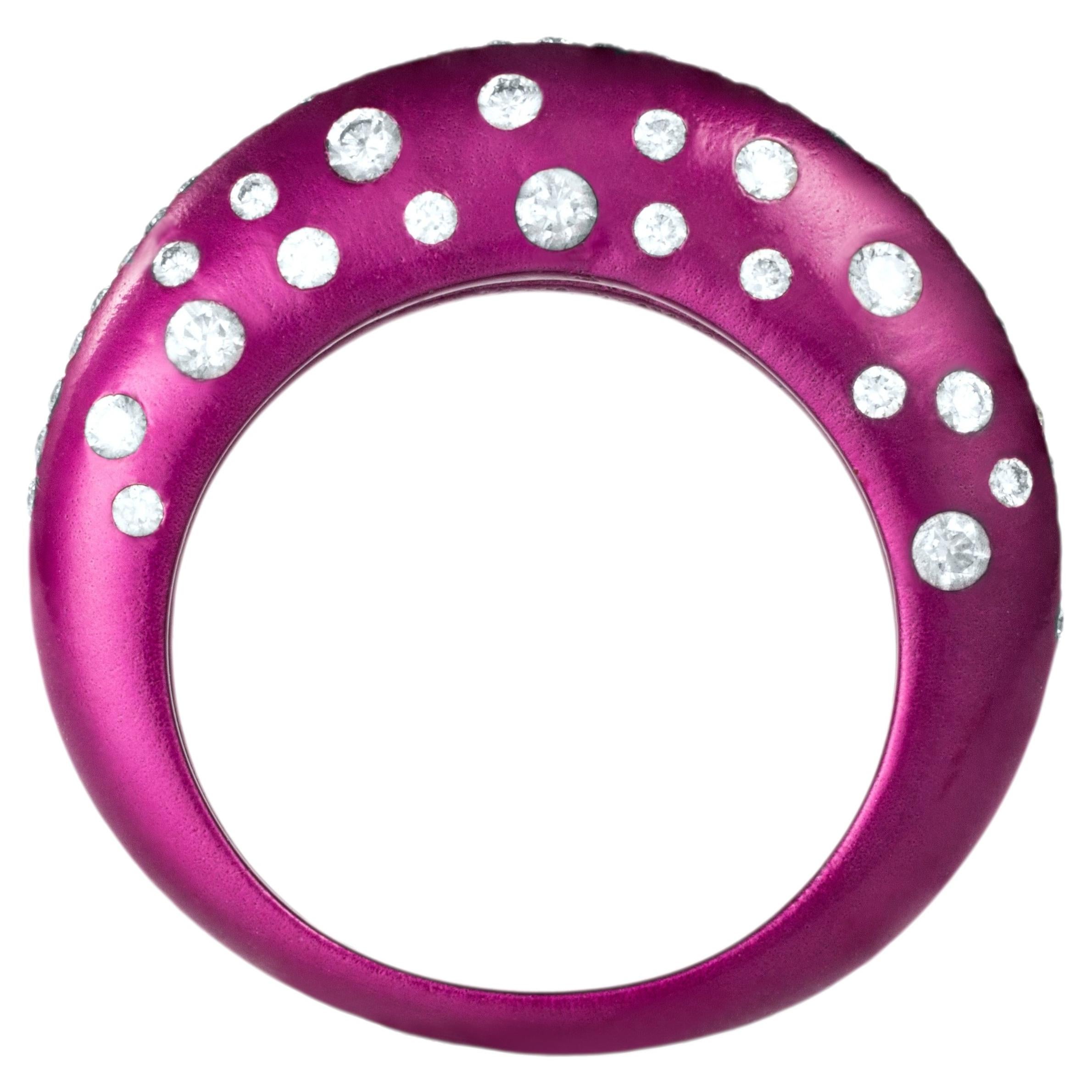 Fuchsia titanium dome ring with scattered graduating diamonds and a pavé diamond For Sale