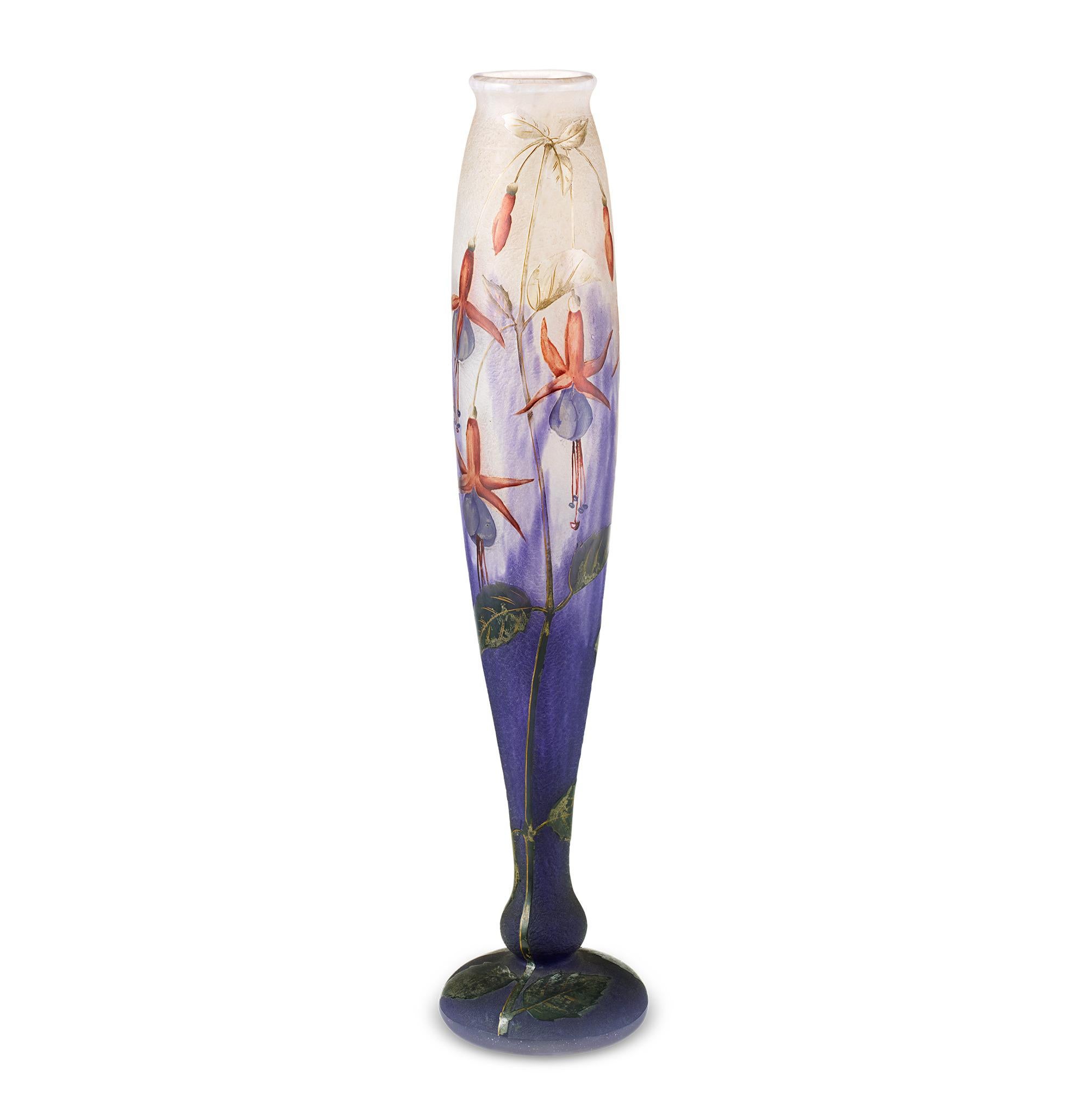 Fuchsia Vase
Daum Nancy
Circa 1900

This exceptional Daum Nancy vase displays stunning enamel-painted fuchsias on its slender form. The vase is a masterwork of Art Nouveau glassmaking, crafted around the turn of the century. Featuring a colorless