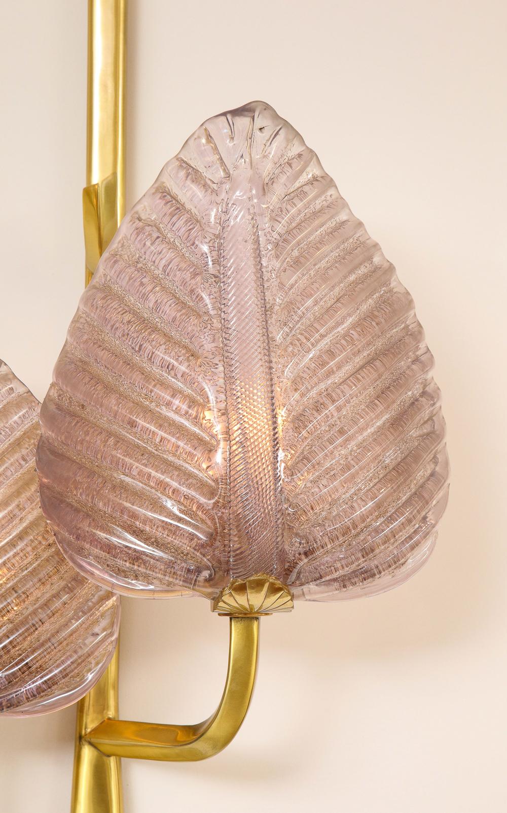 Large amethyst-colored Murano glass leaves with polished, lacquered brass. Each light takes 2 standard E26 bulbs.