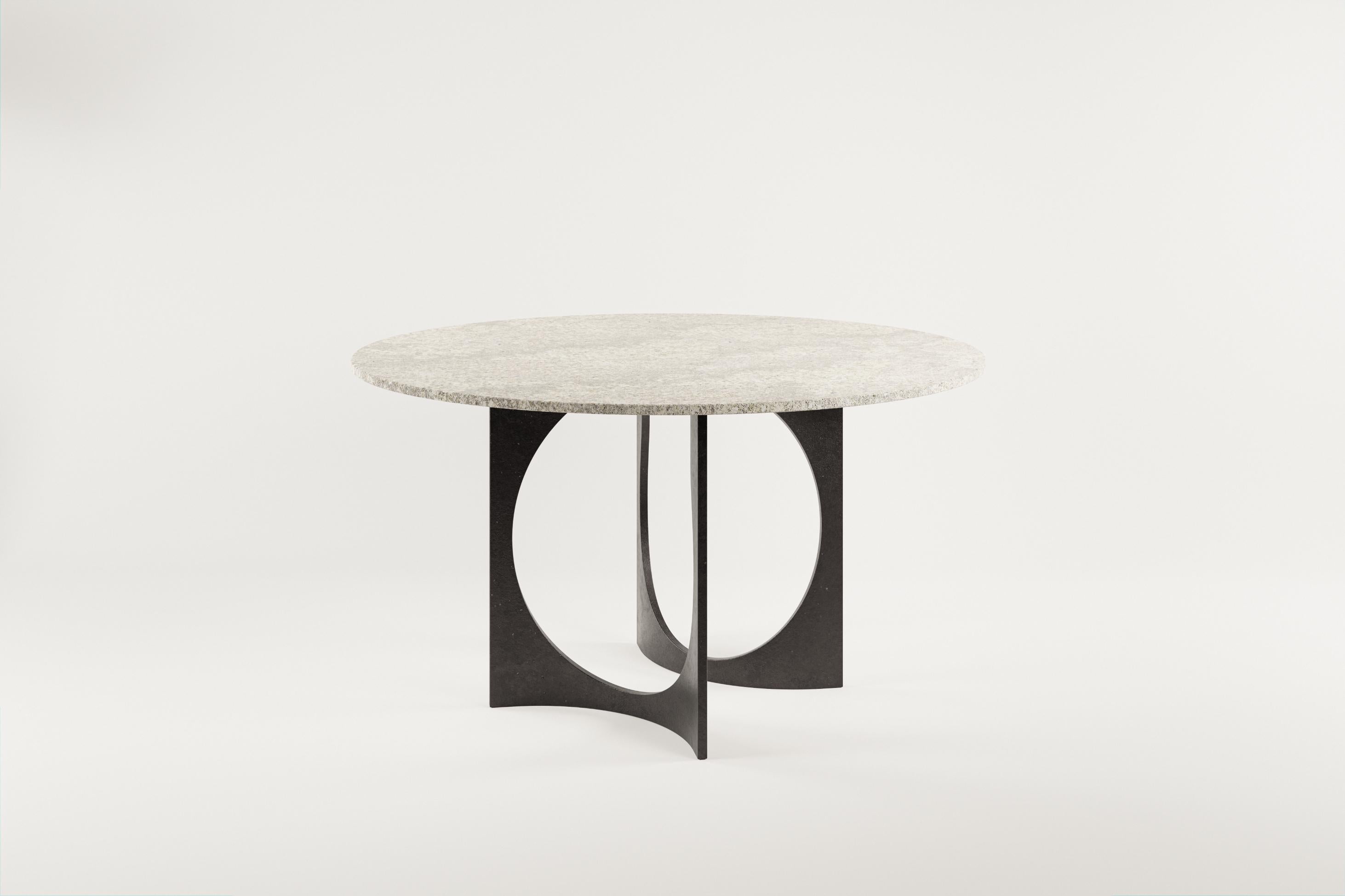 Fuga Dining Table by Metamorphic Art Studio
Dimensions: ⌀ 140 x H 78 cm
Materials: Stone, Cast Iron

The Fuga table is a sculptural table with timeless elegance. The base is handcrafted in Belgium from four identical solid cast elements that are
