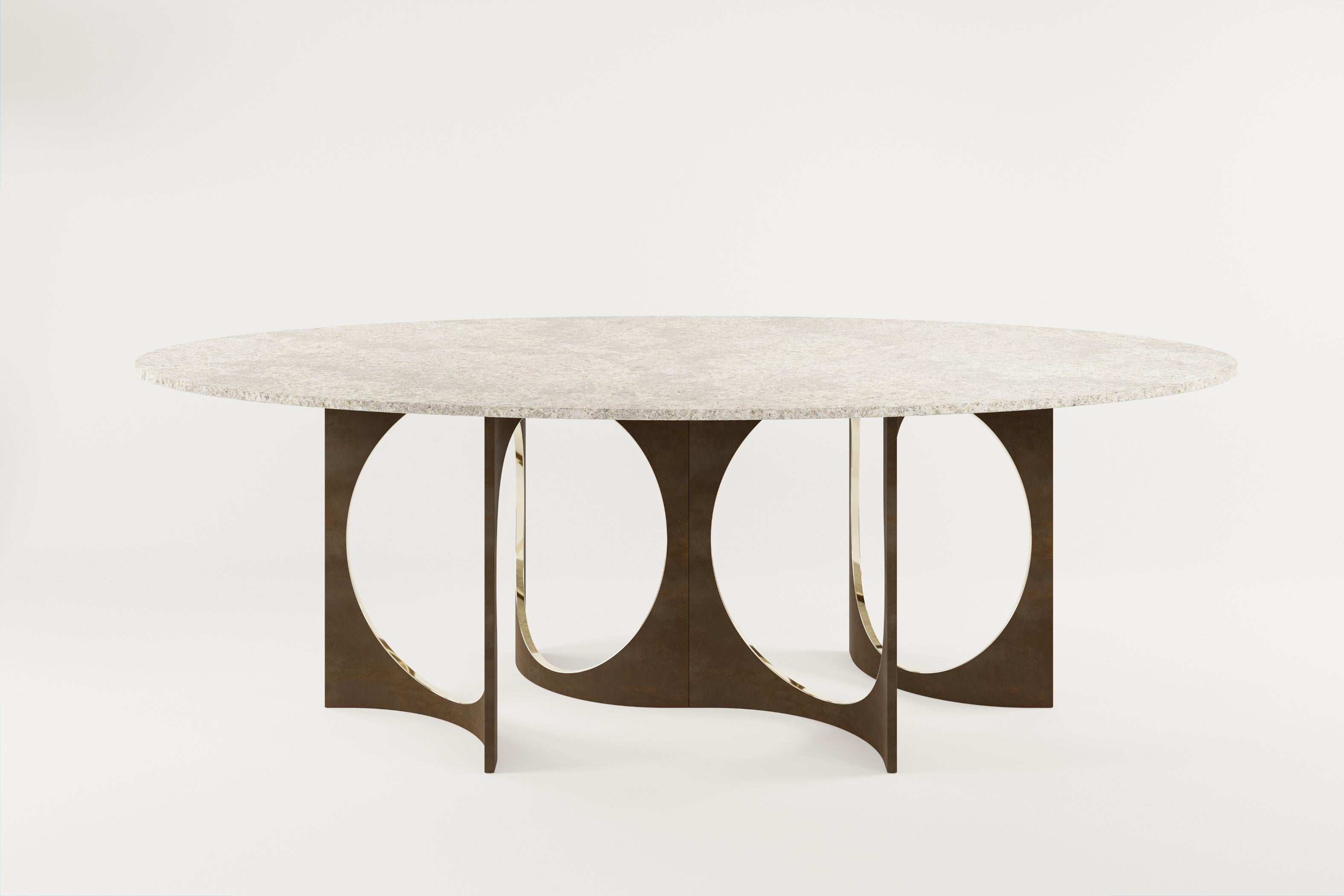 Table de salle à manger Ellipse Patina Fuga Duo avec plateau en pierre par Metamorphic Art Studio
Dimensions : L 240 x D 140 x H 78 cm
MATERIAL : Bronze coulé avec patine, pierre

La table Fuga est une table sculpturale à l'élégance intemporelle. La