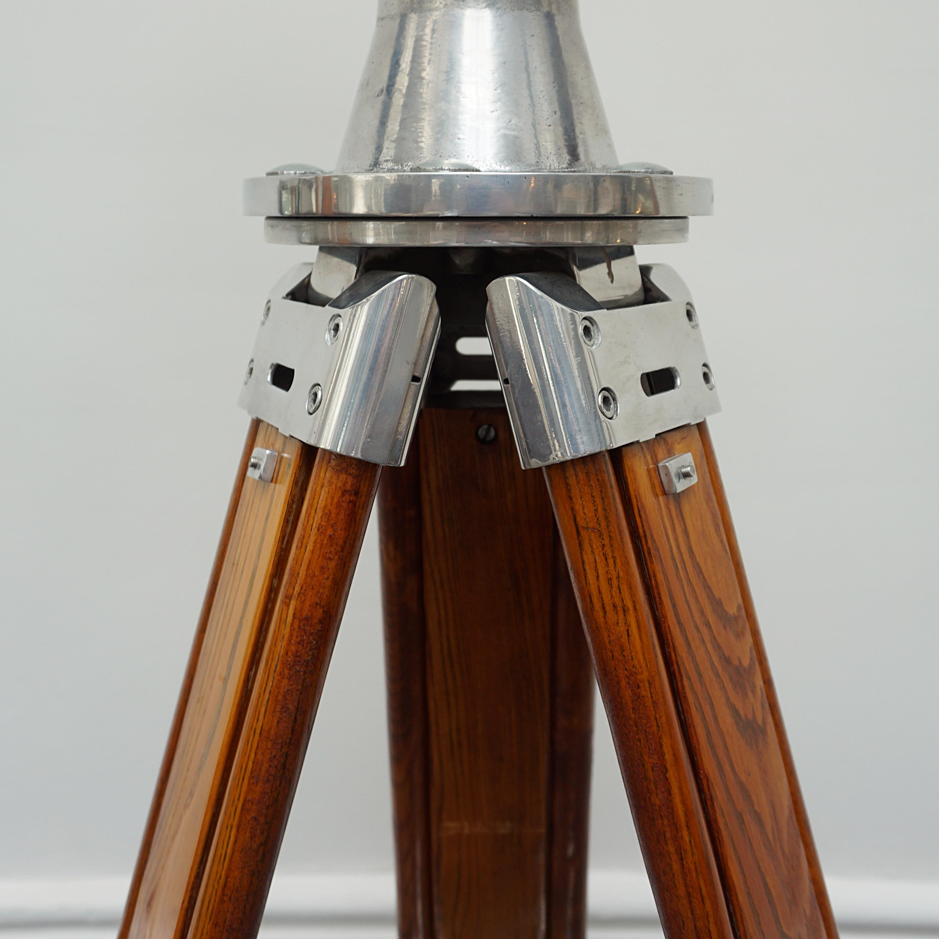 Fuji Meibo 15X80 chrome and brass marine binoculars on later extending wood and chromed metal stand with chromed conical feet. 15X magnification with 80mm objective lens. 

Dimensions: H 50cm W 21cm Length 50cm Stand H 100cm - 180cm 

All of our