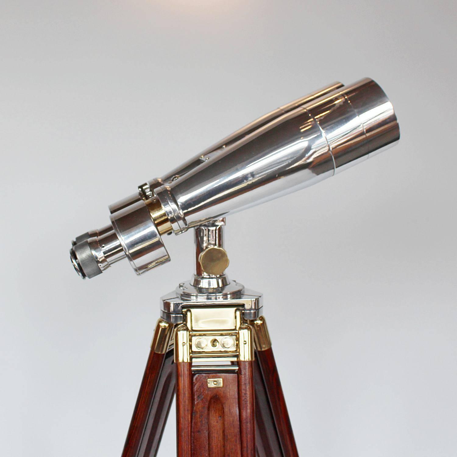 A pair of Fuji Meibo 15 x 80 marine binoculars on later extending wood and brass stand with chromed conical feet. 15 x magnification with 80 mm objective lens.
Paint stripped and metal polished. Fully refurbished optics

Stamped Fuji Meibo and