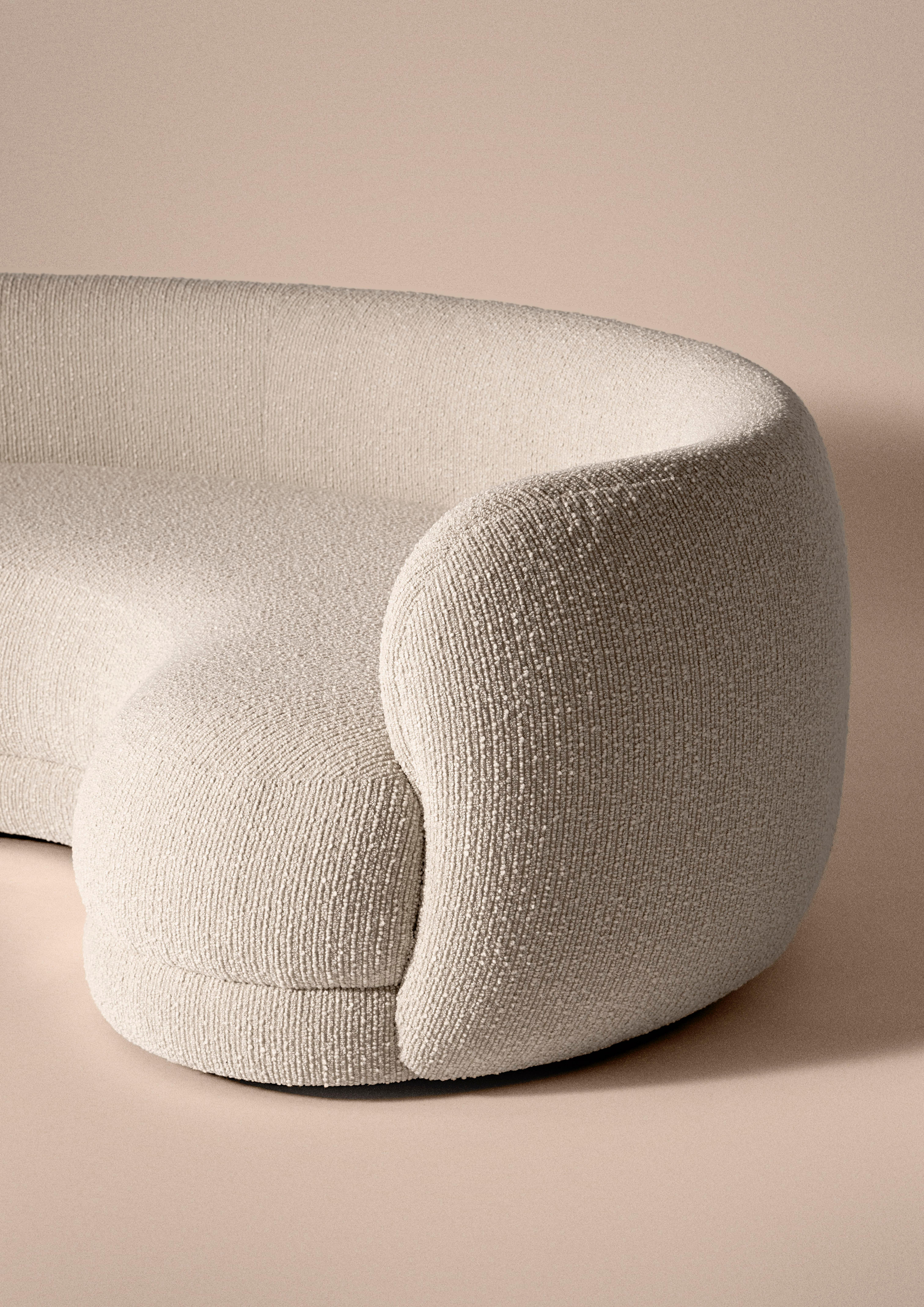 Rounded sofa upholstered in textured cream bouclette fabric (LG.FB-17), with a discrete oak base. Featuring incredibly comfortable upholstery and soft structure made of non-deformable foam. Handcrafted in France.