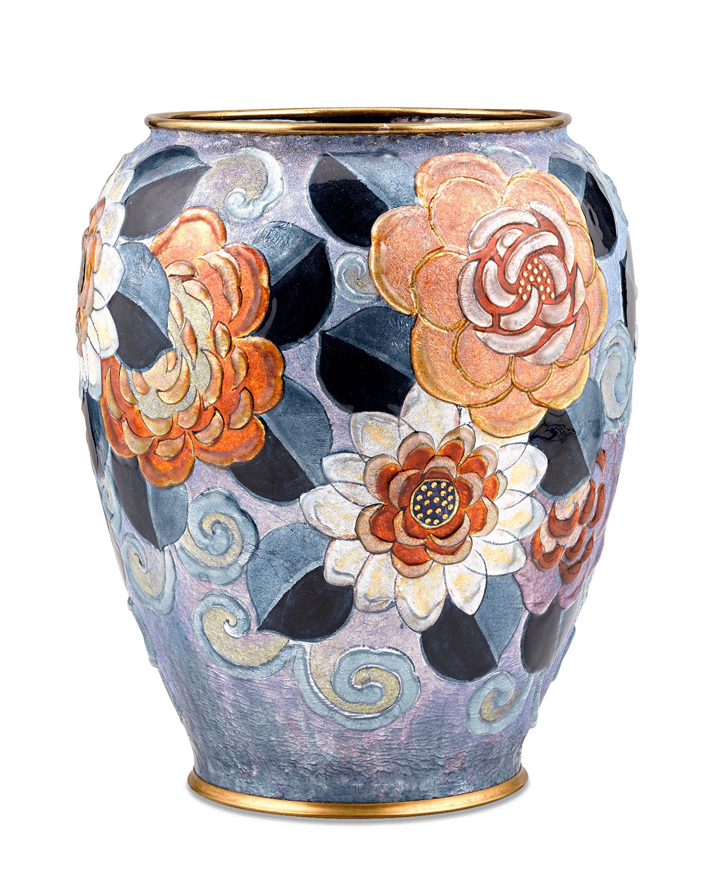 Brilliantly colored flowers are in full bloom on this rare Limoges enameled vase by Camille Fauré. Decorated in a vibrantly hued floral motif, this vase is a feast for the senses, featuring a tactile as well as visual beauty. The vase's unique