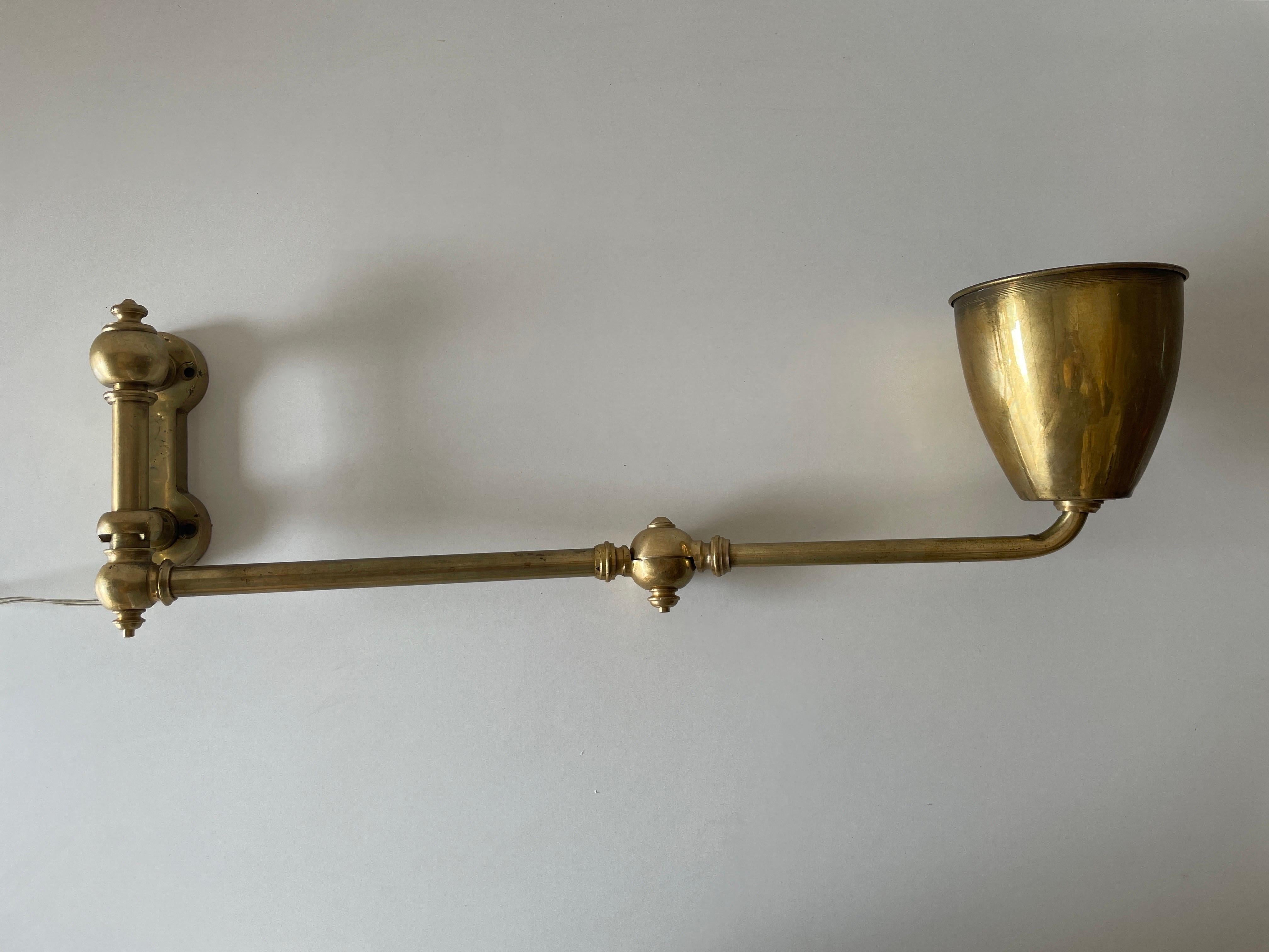 Full Brass Adjustable Head and Arm Industrial Task Wall Lamp, 1940s, Germany

Very nice high quality wall lamp.

Lamp is in very good vintage condition.

These lamps works with E27 standard light bulbs. 
Wired and suitable to use in all countries.