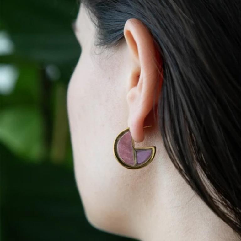 These earrings illuminate the profound simplicity of the circle contrasted by the deep symbolism of this shape. Not to mention they look great on! The Full Circle Hoops add that subtle yet bold pop of color and contrast to any look. These earring