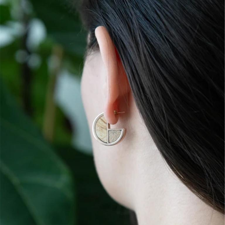 These earrings illuminate the profound simplicity of the circle contrasted by the deep symbolism of this shape. Not to mention they look great on! The Full Circle Hoops add that subtle yet bold pop of color and contrast to any look. 

