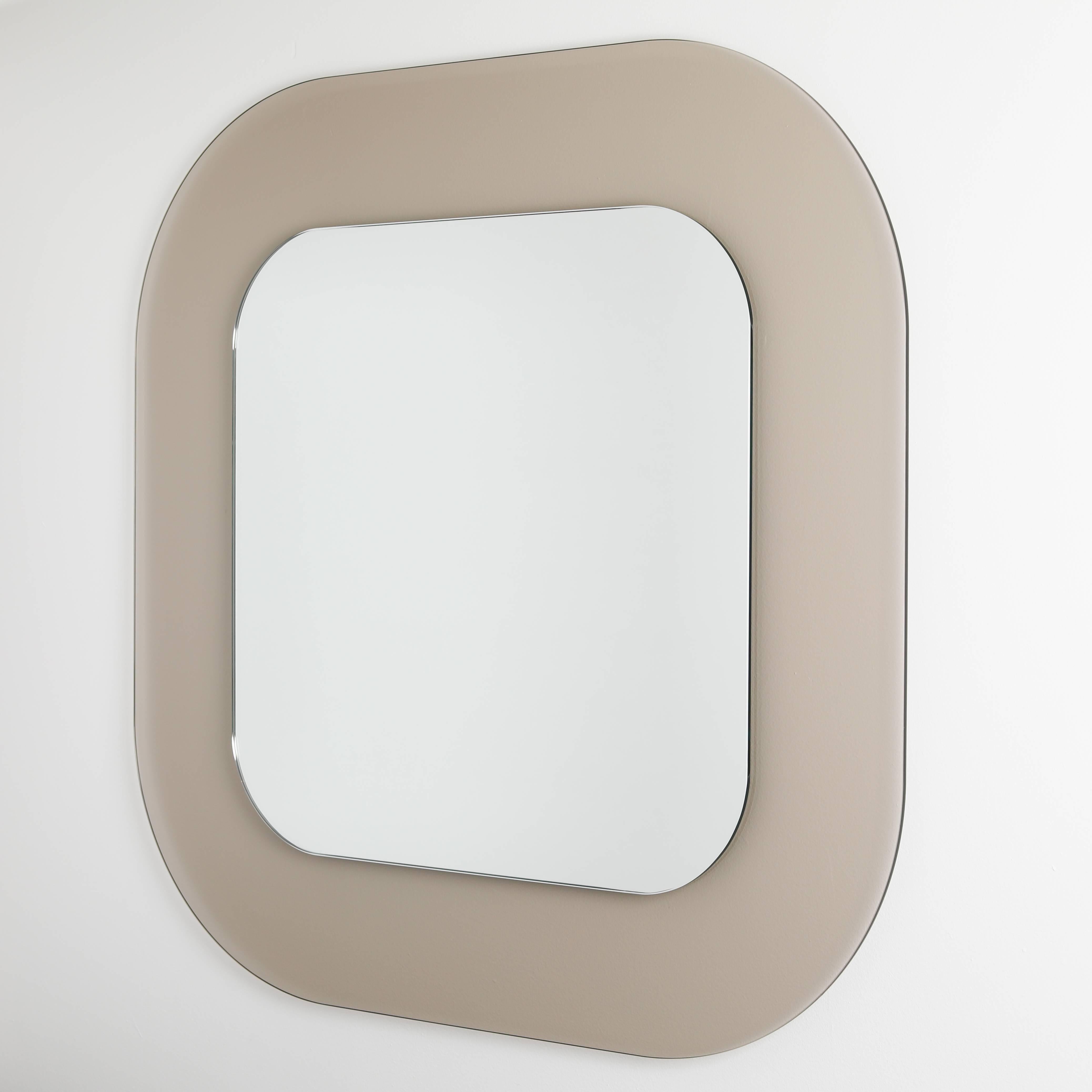 This piece is part of a new line of full circle modern original fully customizable, acrylic-frame mirrors. The translucent frames are reminiscent of the 1950s curvaceous glass designs by legendary Italian maker Fontana Arte, but with shapes and