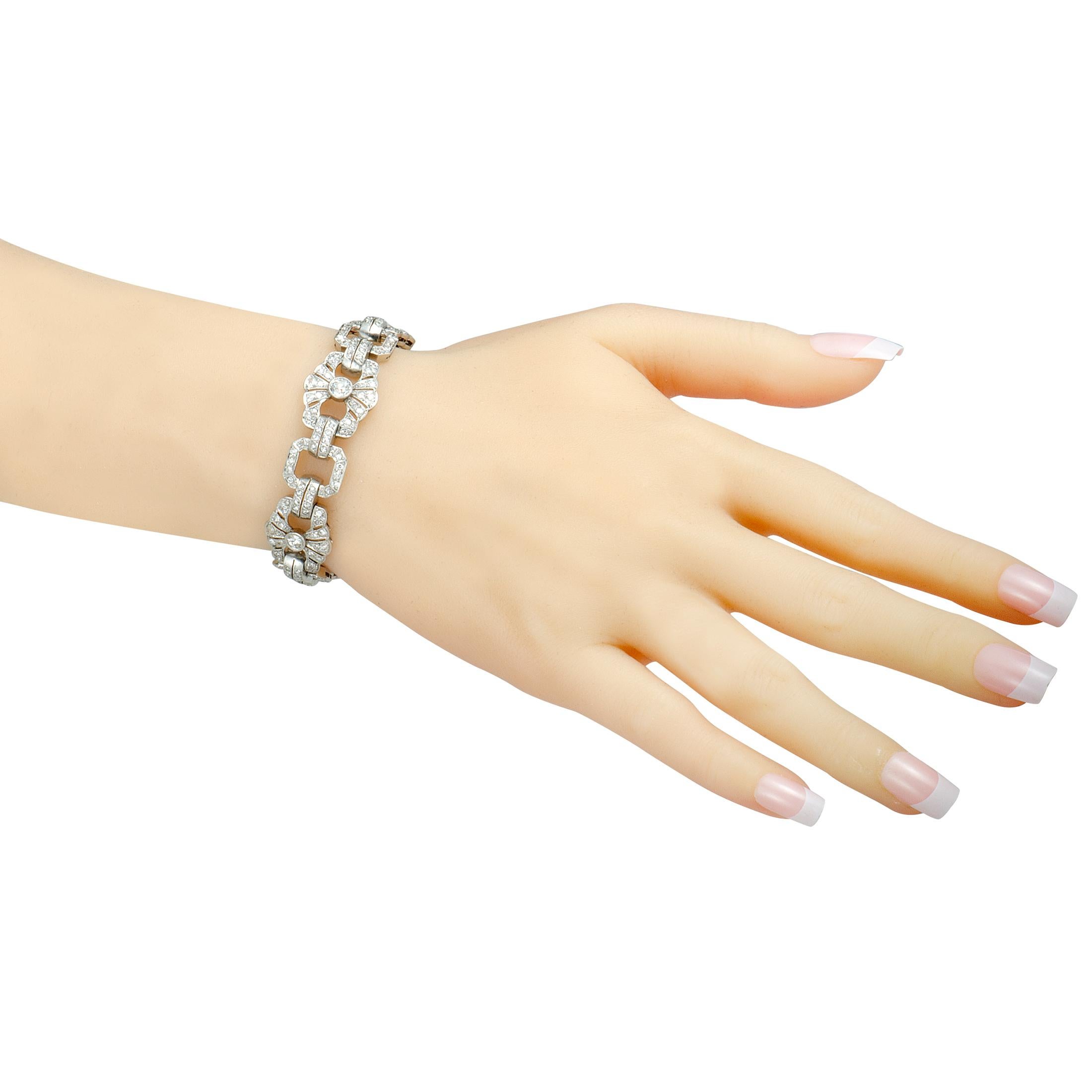 Extravagance embodied, this fabulous bracelet will make any outfit of yours a standout ensemble, thanks to the exceptionally refined design and stunningly lustrous diamond décor. The bracelet is expertly made of platinum and it is set with a total
