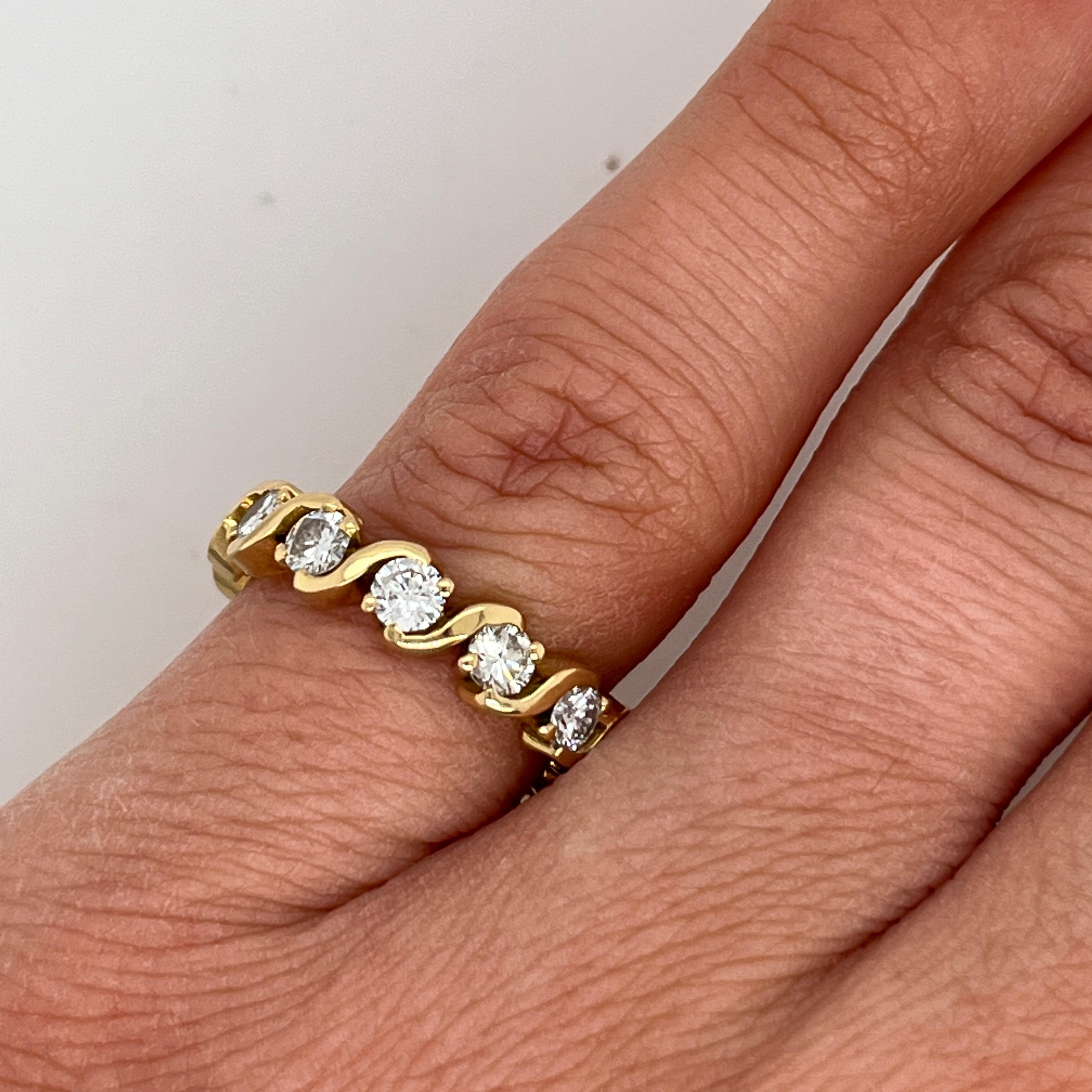 A timeless symbol of love and elegance, this classic eternity ring is crafted in luxurious 18ct yellow gold and set with 1.50 carats of natural round brilliant cut diamonds. Perfectly matched for brilliance and sparkle, the diamonds encircle the