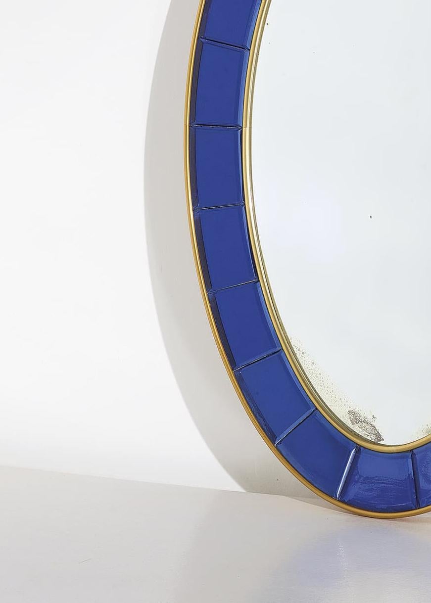 An impressive full-length mirror by crystal art, Italy circa 1960. The mirror is framed by beveled cobalt blue. Glass panels in a gilt metal and wooden frame. The design is typical of crystal art and appears in early catalogues. The mirror has two