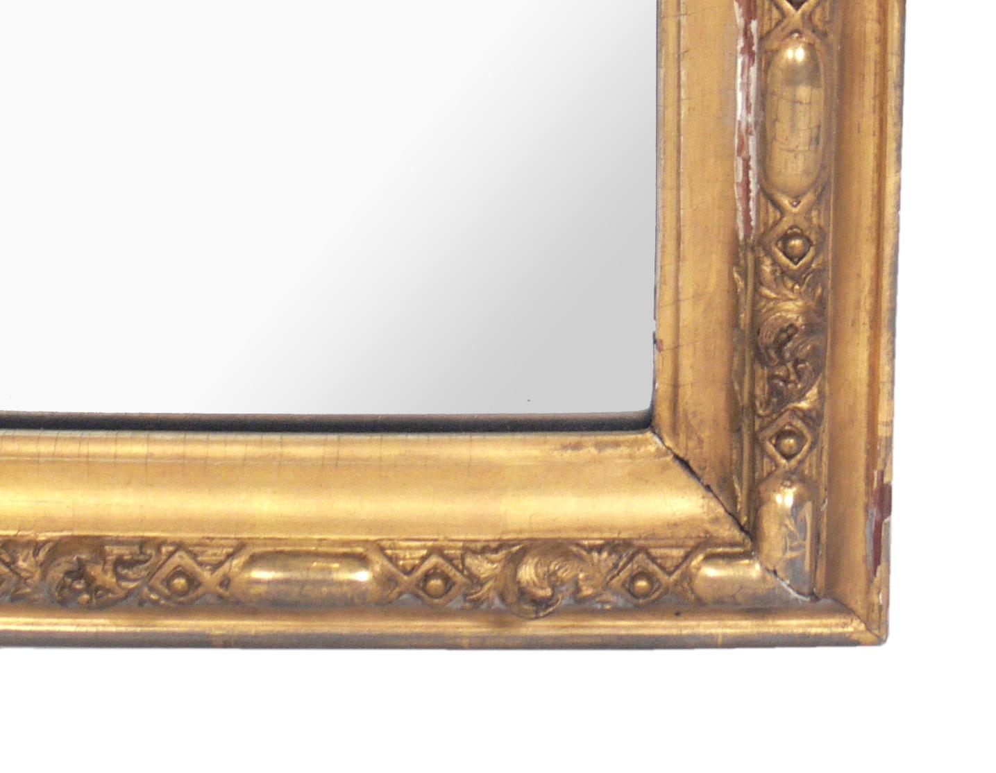 Full length 19th century gilt mirror, probably French, circa late 19th century. It is an impressive size at just over 7 feet tall. It would be equally at home in a grand foyer or dressing room, or in a retail store or boutique. Retains warm original