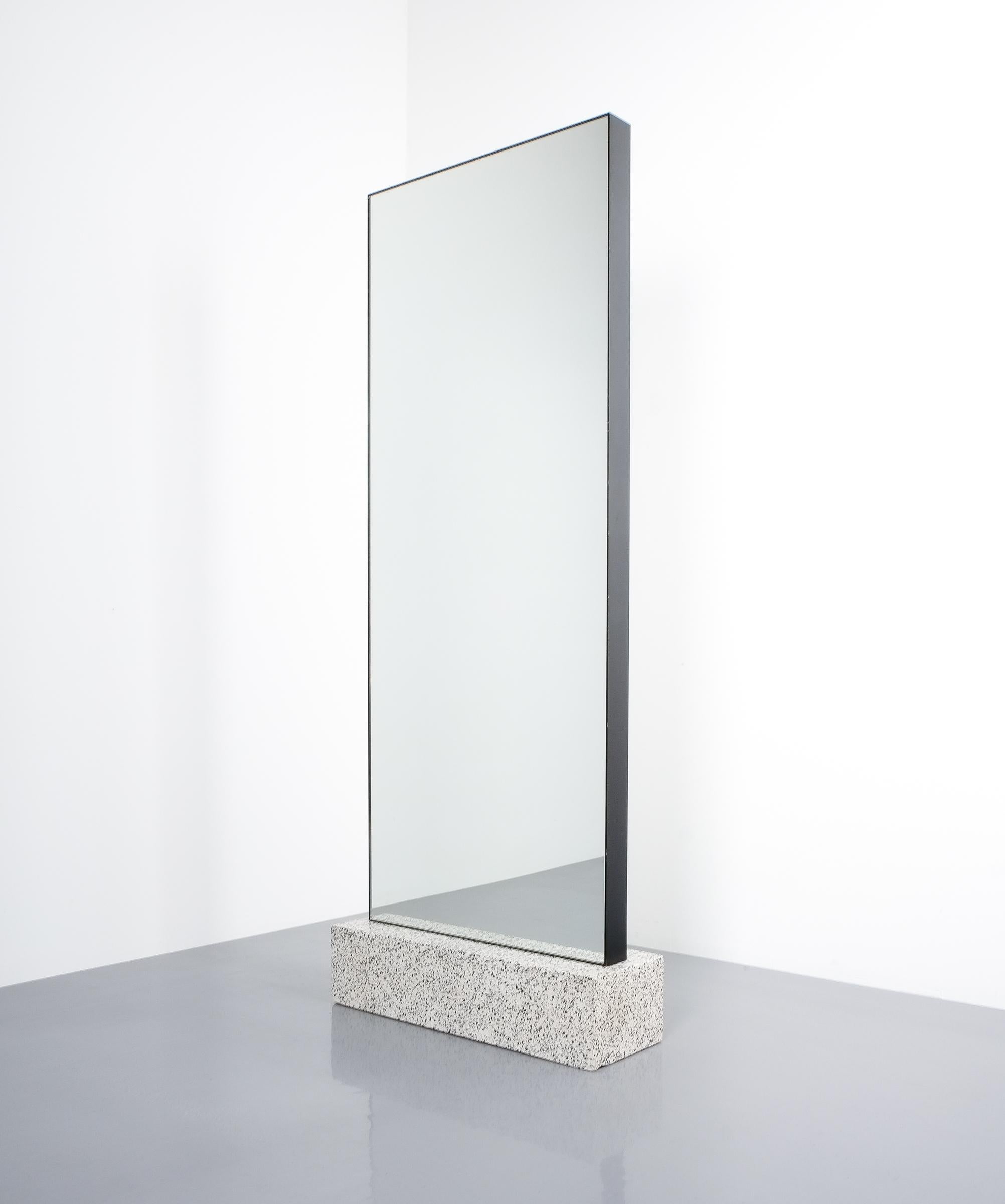 Full length double mirror with terrazzo base style, Memphis. Probably produced, circa 1985 in Italy. Stylish double mirror with a heavy cast terrazzo base and iron framed mirror. Good condition with one chip to the base. Very heavy minimalistic