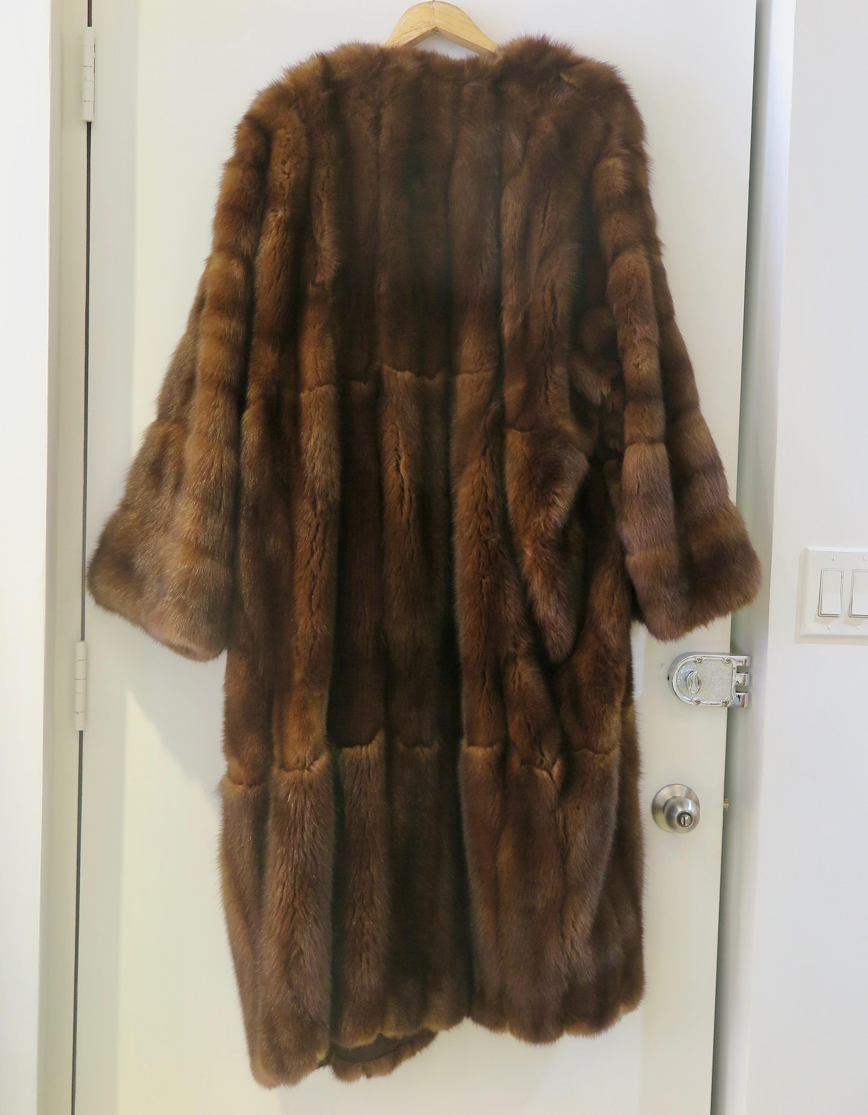 Full length vintage Russian sable coat in Kimono shape by the talented Zurich based team Andre + Lisa Bisang , Switzerland, ca 1985.
 Label: Andre Bisang fourrures.
The coat is lined with black silk. 