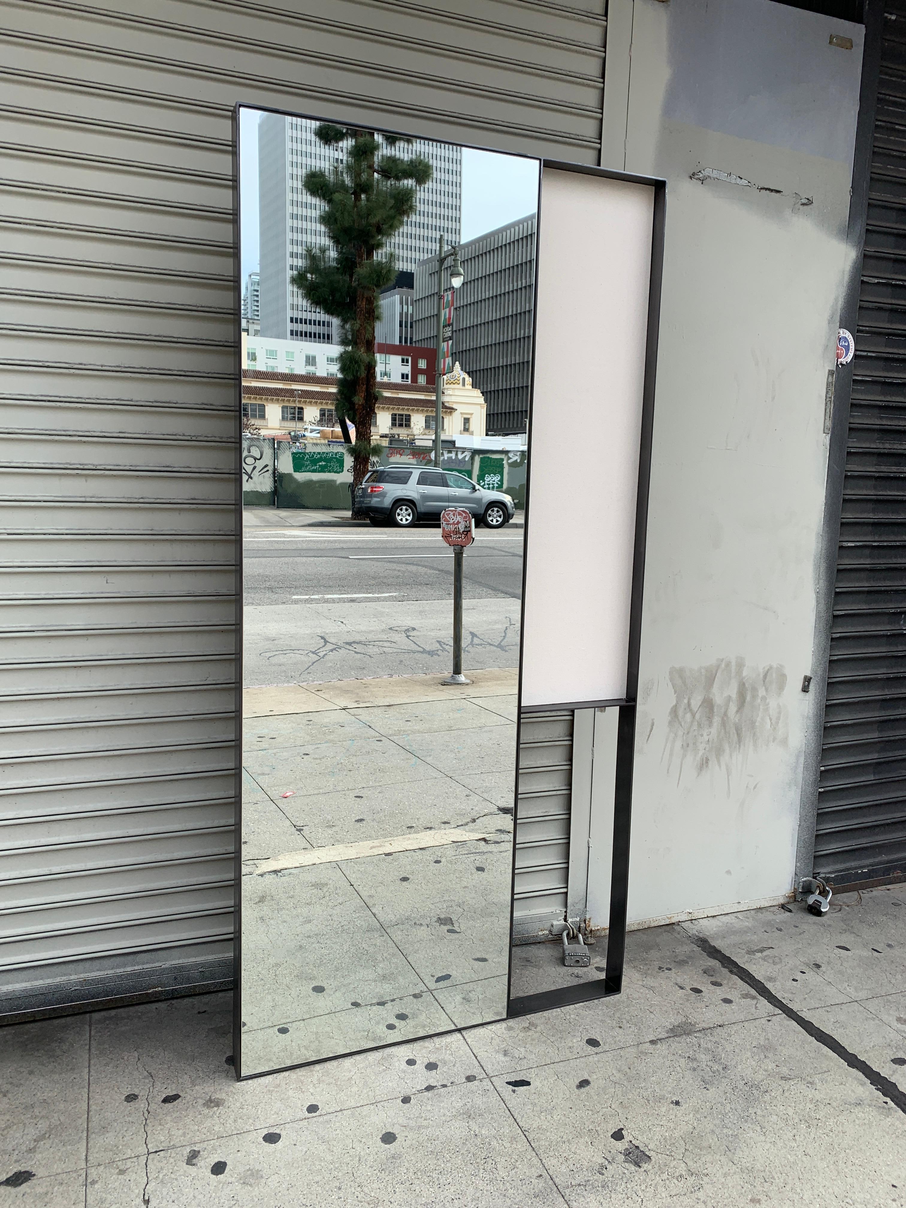 Stunningly beautiful full length or mirror encased in a 2.50 inches metal frame that is 1/4 inch thick and heavy, the mirror also has a framed canvas on the side and another area that is open.

The metal is beautifully finished in antique oil