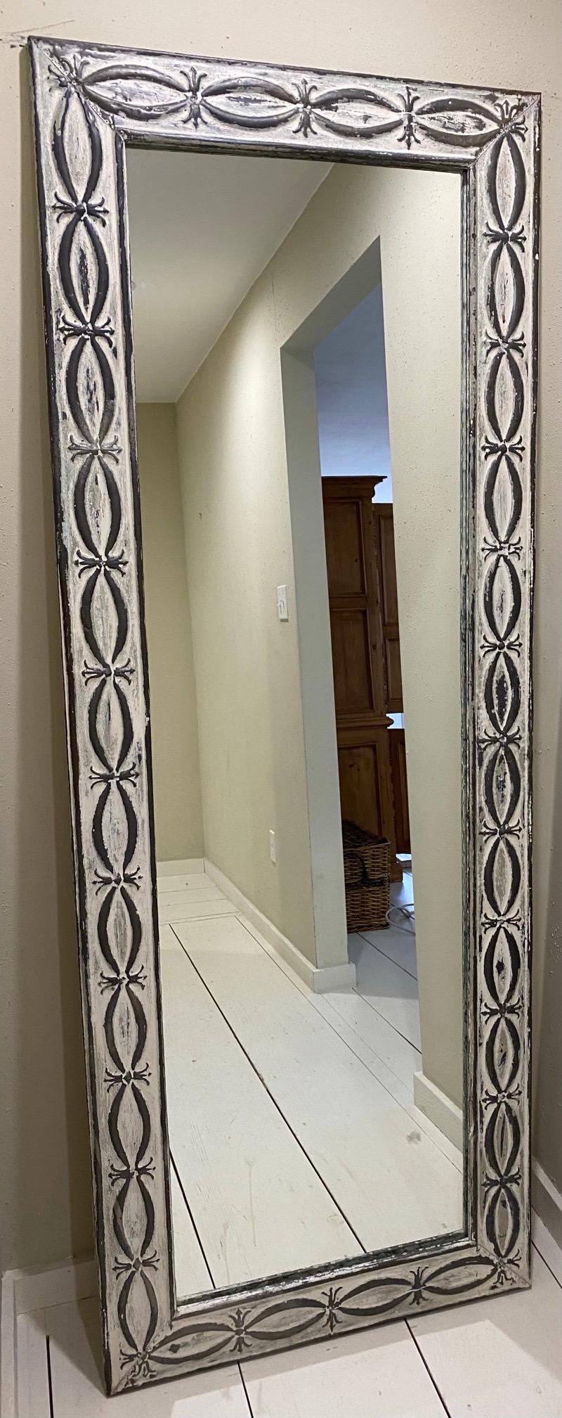 Industrial style full length floor mirror made with antique tin ceiling tiles in the classical fish design.
 