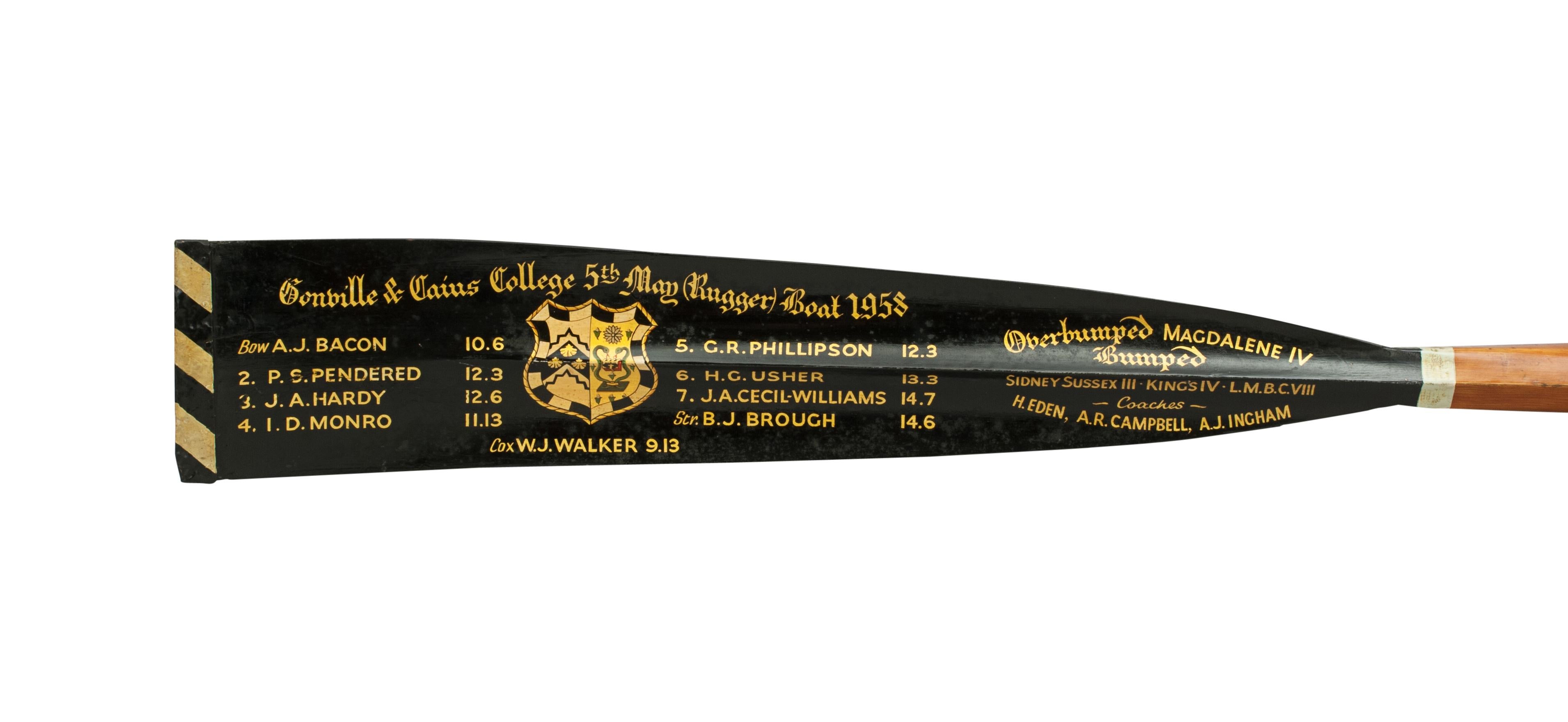 Rowing Oar Blade, Gonville & Caius College, 5th May (Rugger) Boat 1958.
The full length 12' oar is a traditional Gonville & Caius College (Cambridge University) presentation rowing oar with calligraphy and college insignia. The writing on the