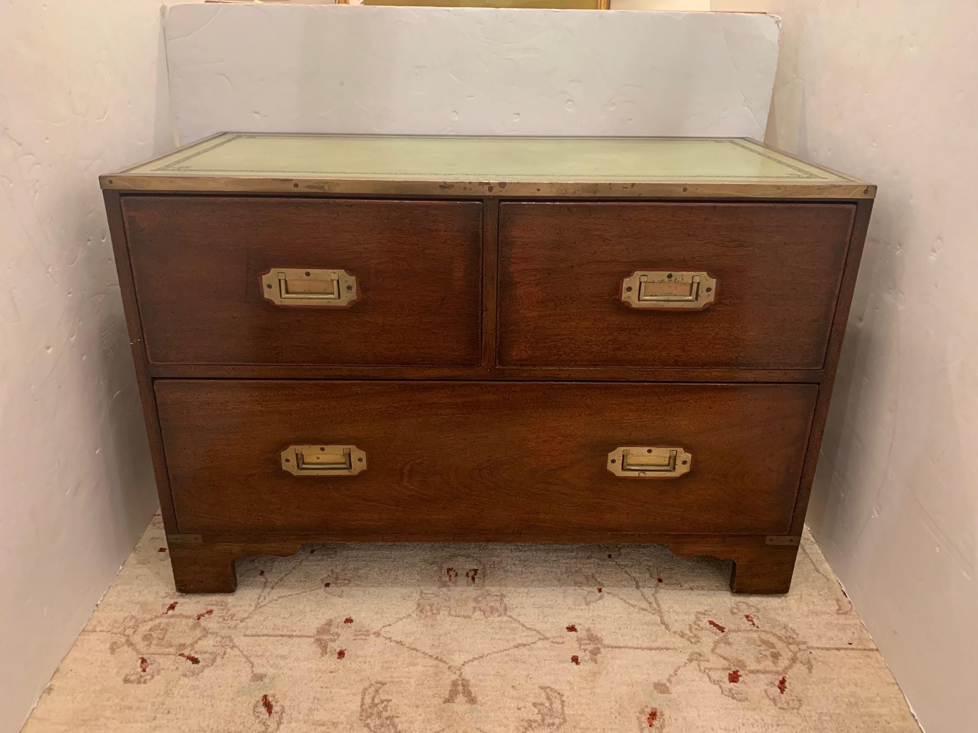 Full of old world character, a Campaign style chest of drawers having brass recessed hardware and fabulous weathered green tooled leather top.
Found in Nantucket.

Measures: 36” W x 18” D x 24.5” H.