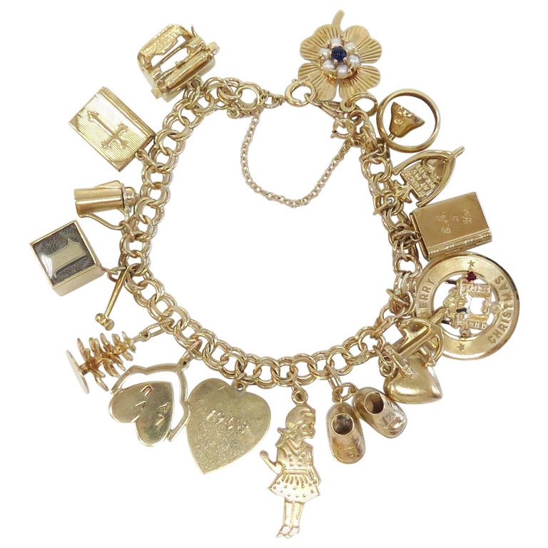 Full of Charms 1950s Charm Bracelet 14 Karat Yellow Gold at 1stdibs