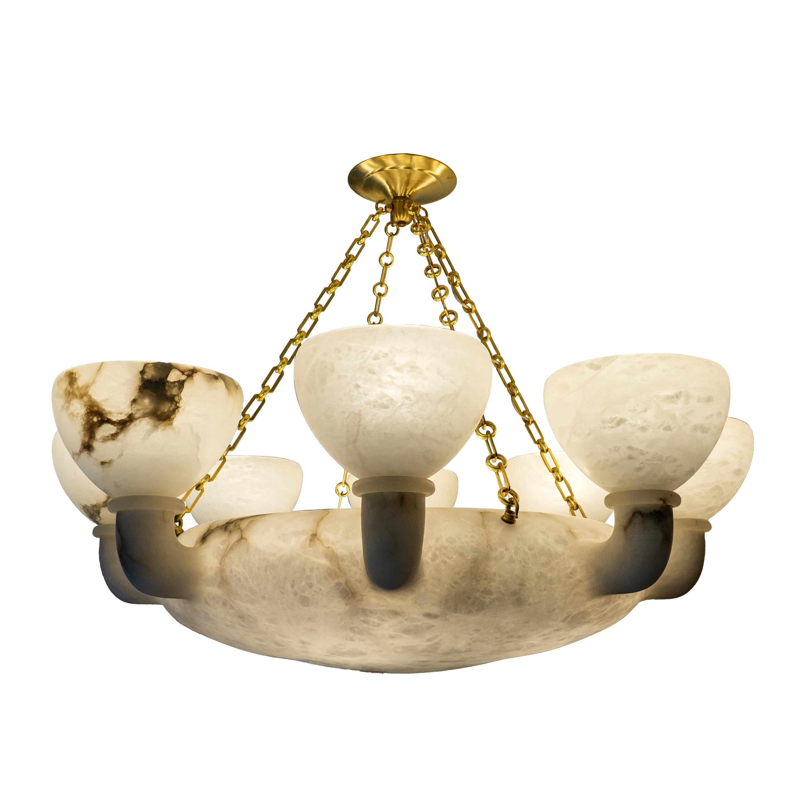 Experience unparalleled sophistication with this extraordinary candelabra-style fixture, a testament to meticulous craftsmanship and rare design finesse. Crafted from a single block of stone, its balanced and proportionate silhouette is a rarity in