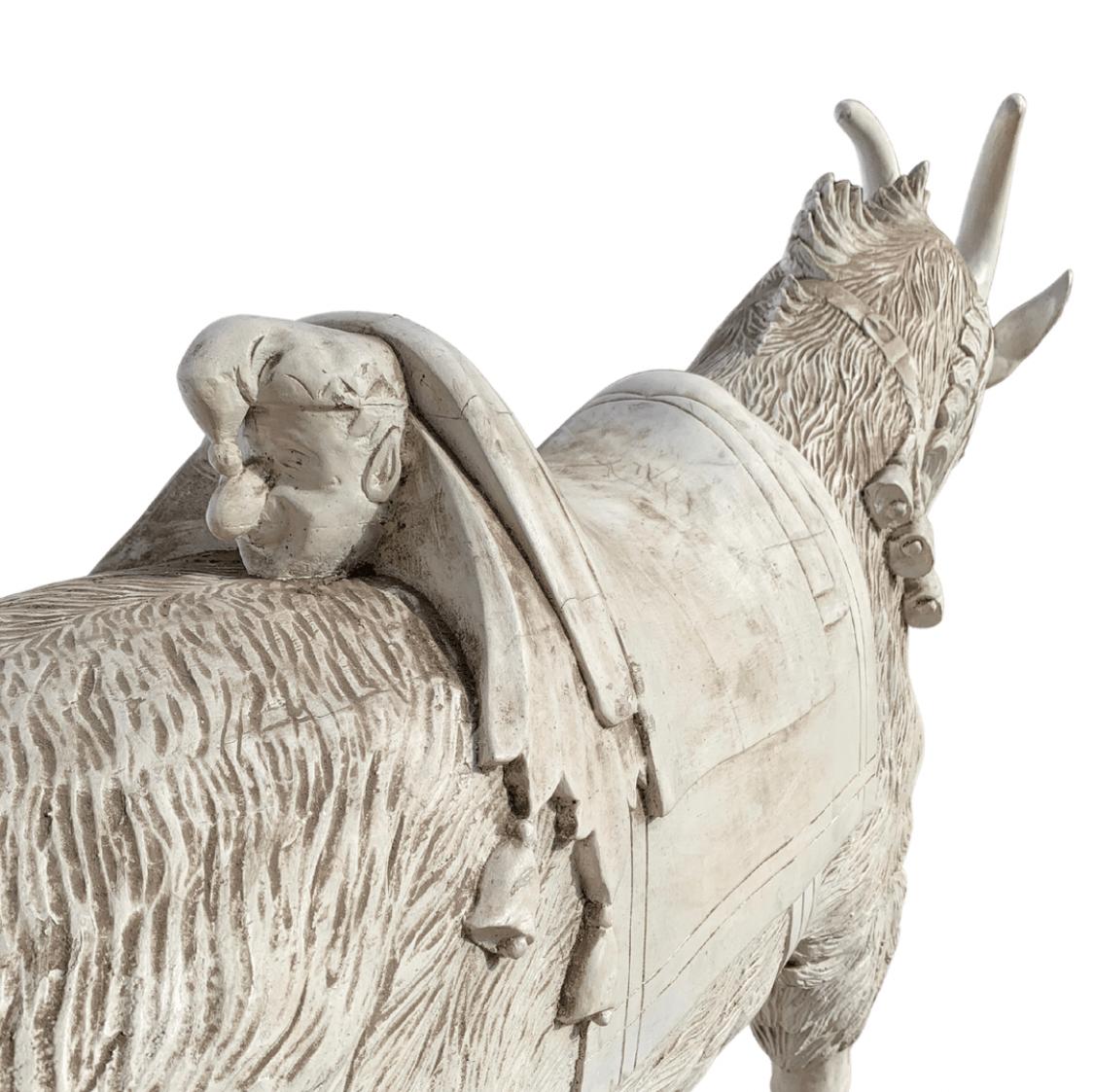 Full size wooden carousel goat with Punchinello carved on the back of the saddle. Punch was one of the turn-of-the -century’s most popular characters known to most children.
Carved in the style of DC Muller Brothers, carousel carvers from