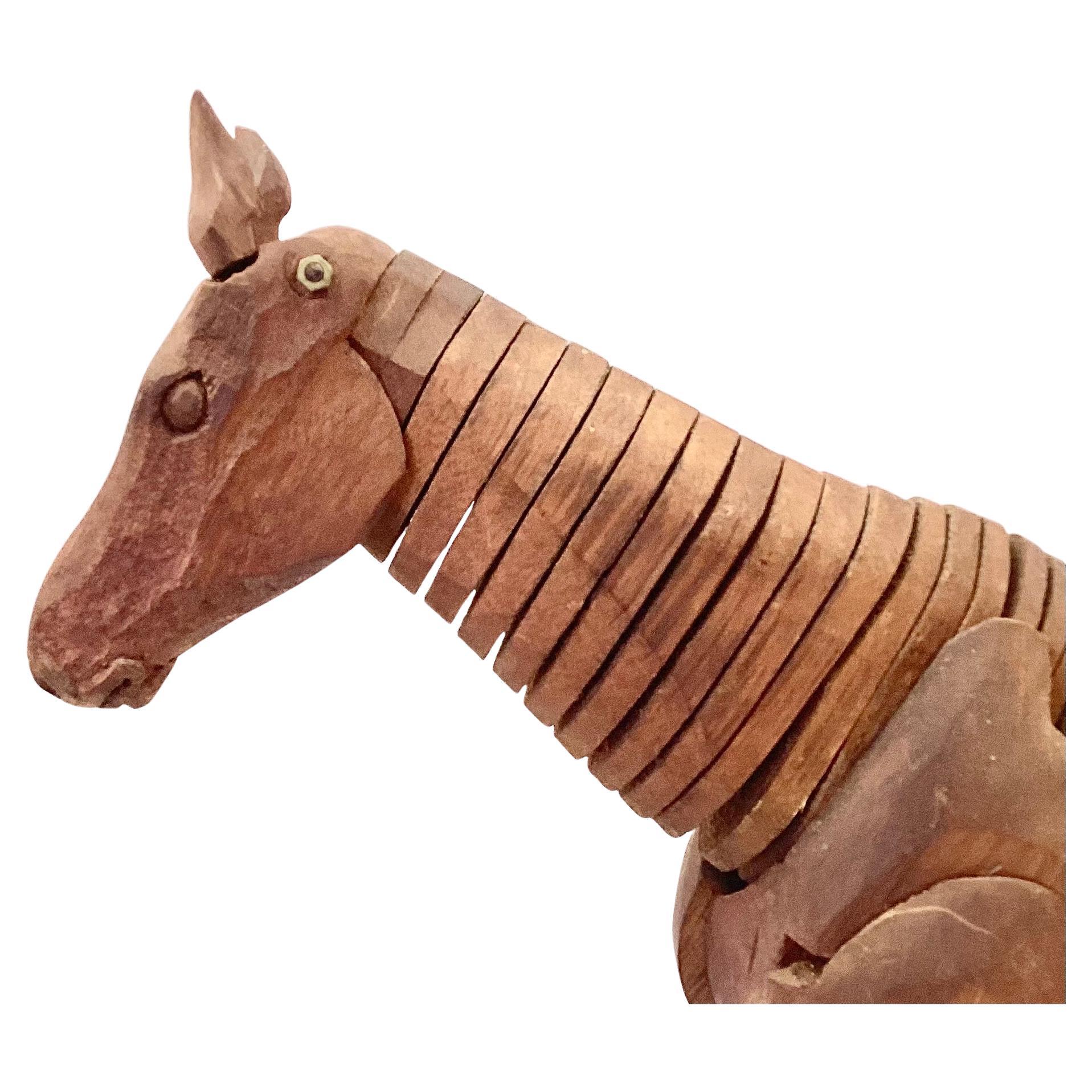 Antique hand-carved artist's model of a horse, fully articulated at every level including wooden ears. Has a horsehair tail. Fixed on a brass stem and raised on a wooden base. Artist signed on base as Philippe Leo. 